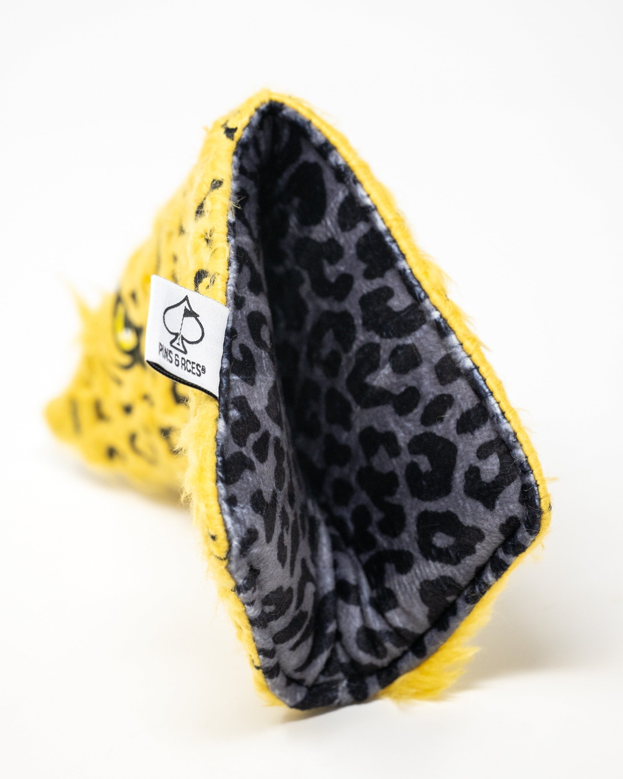 Leopard blade putter cover featuring a vibrant yellow exterior and a sleek black leopard print interior.