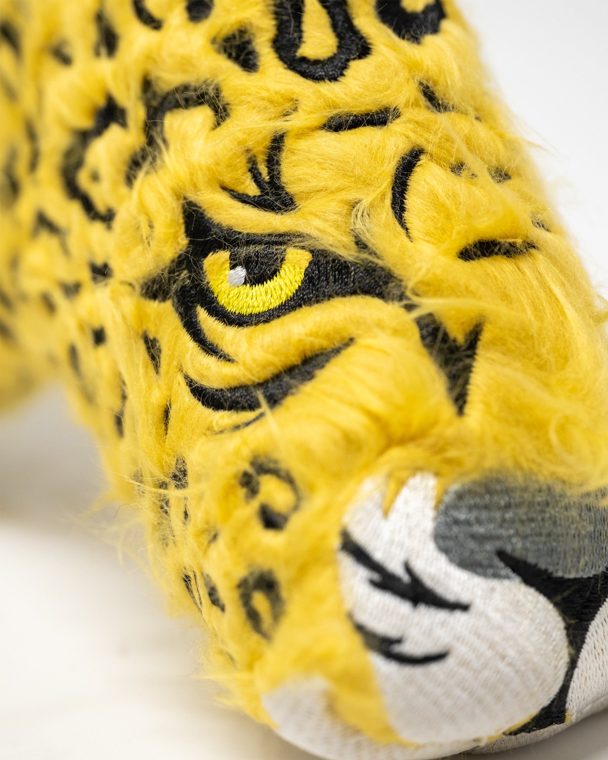 Bold leopard print blade putter cover featuring vibrant yellow fur and striking black details for a standout look on the course.