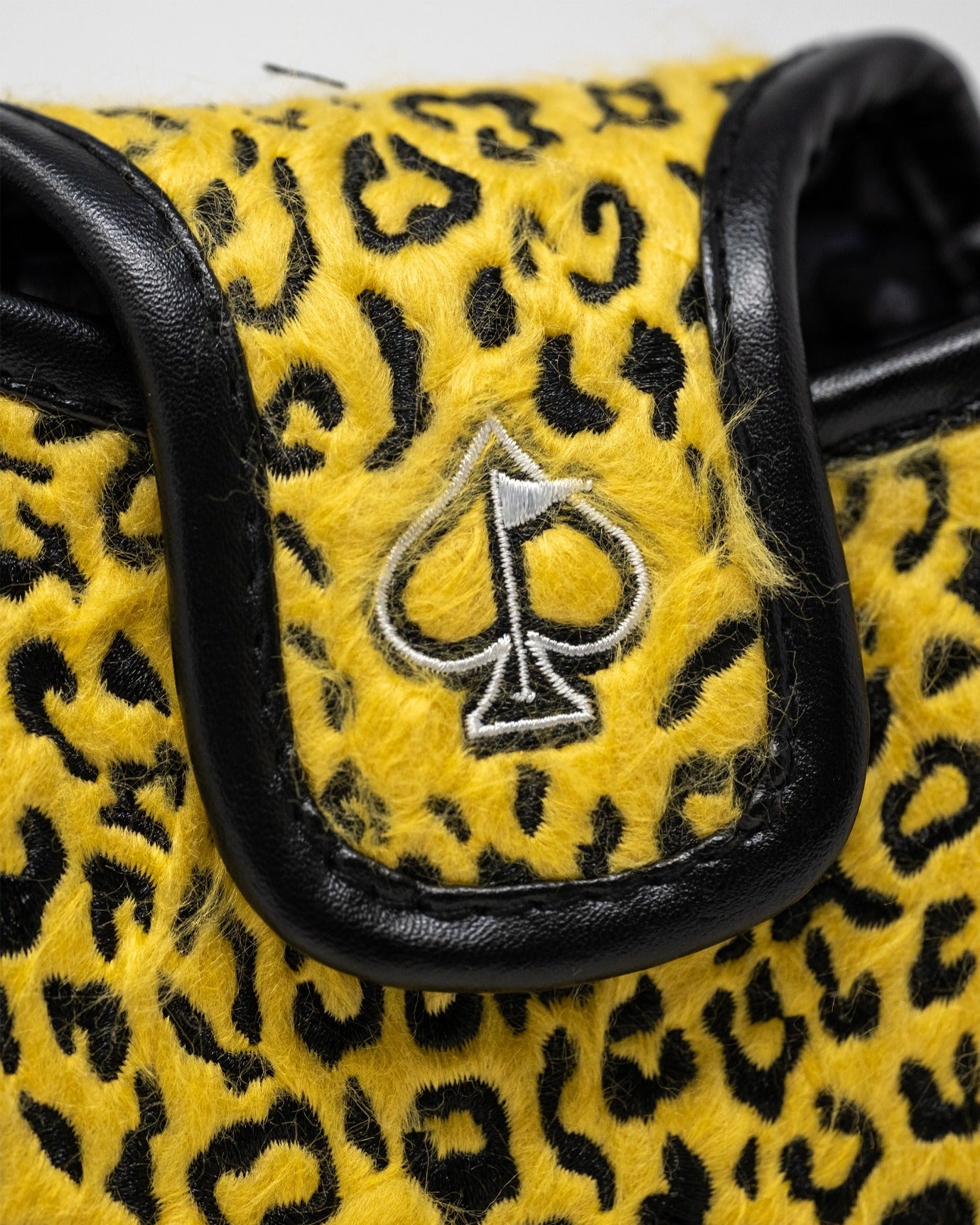 Leopard mallet putter cover in vibrant yellow with black leopard print and a sleek black trim, featuring a spade logo.