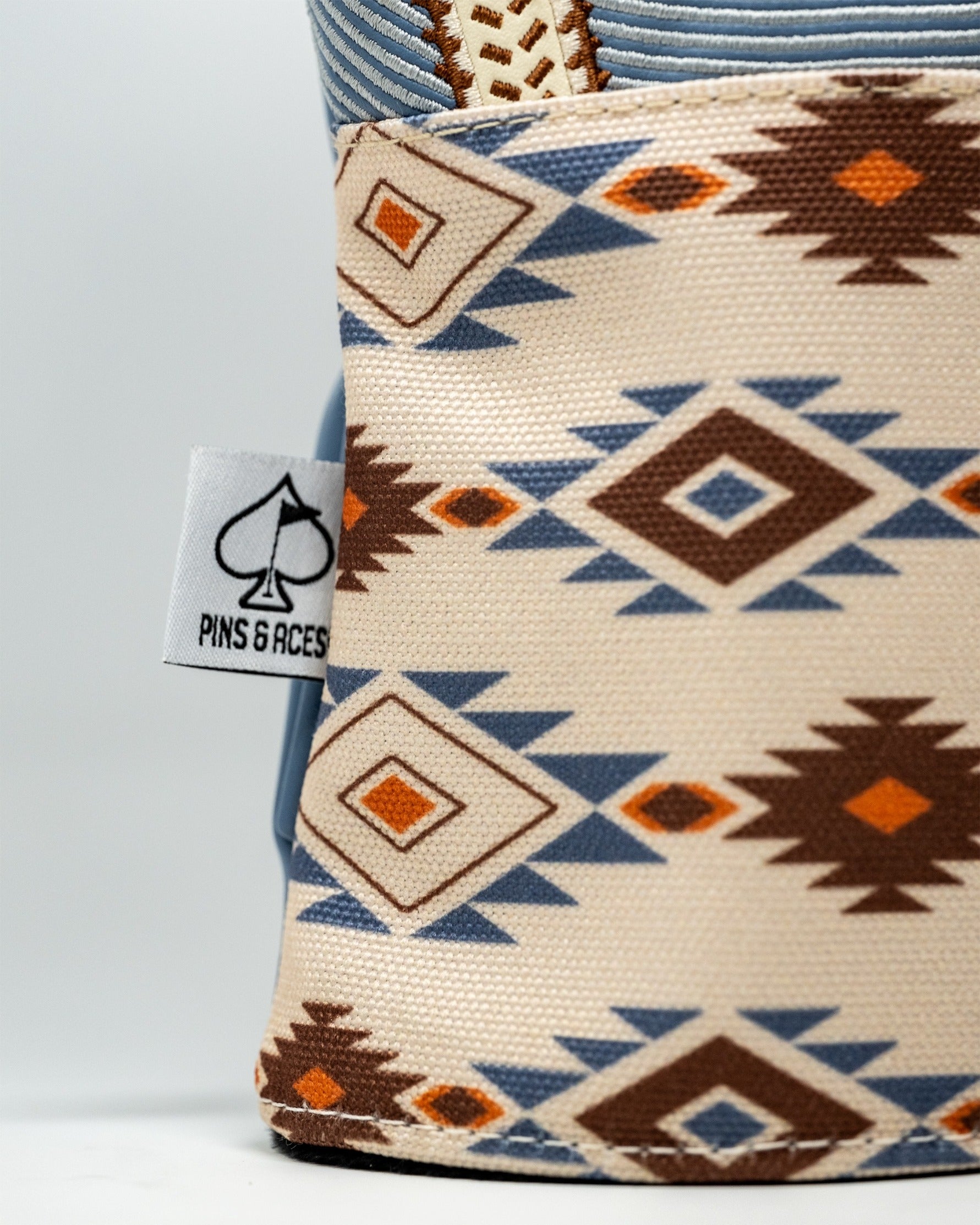 Western aesthetic driver cover featuring a geometric pattern in earthy tones, designed for stylish golf protection.