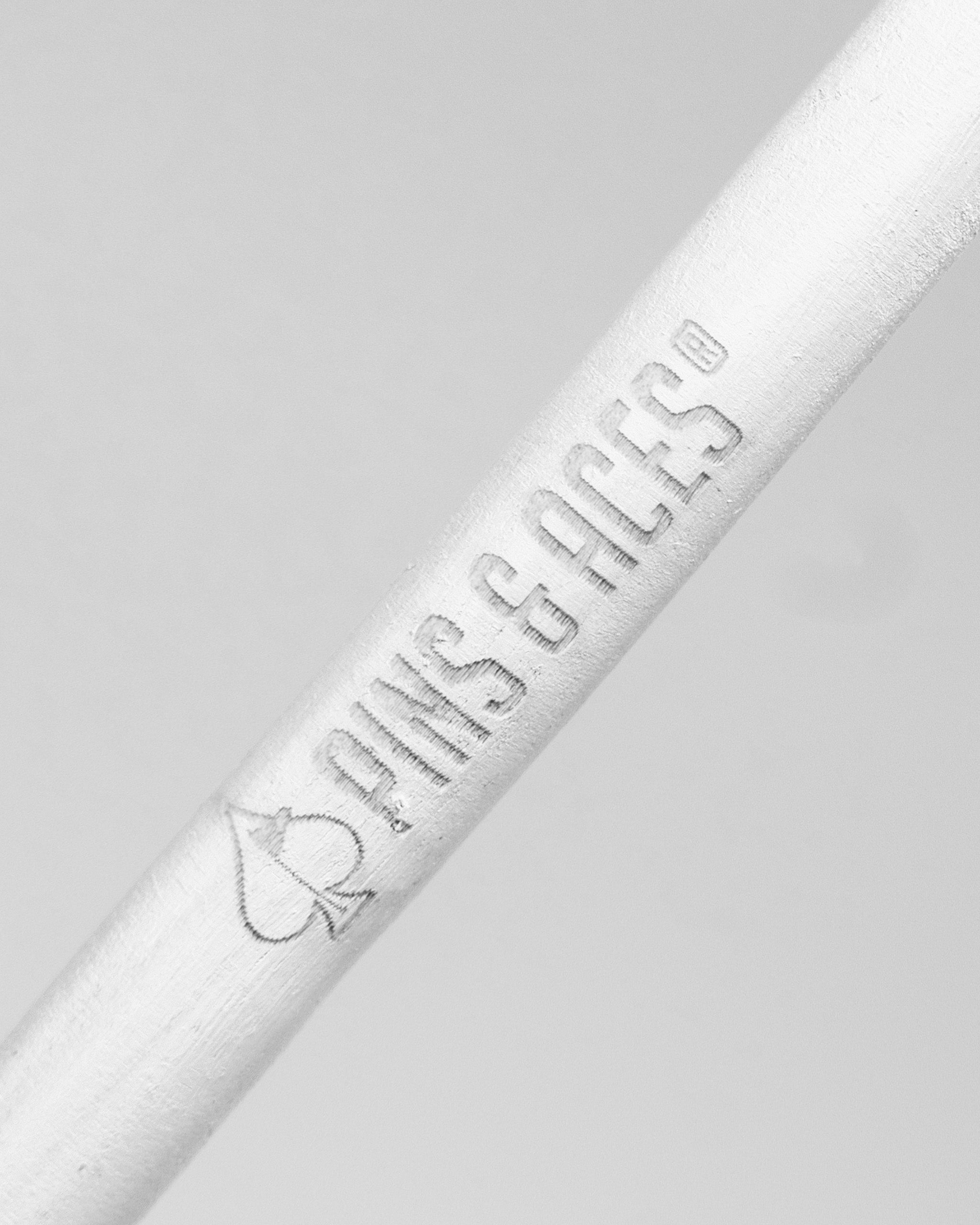 White alignment sticks from Pins and Aces, designed for golfers to improve their swing and aim accuracy on the course.