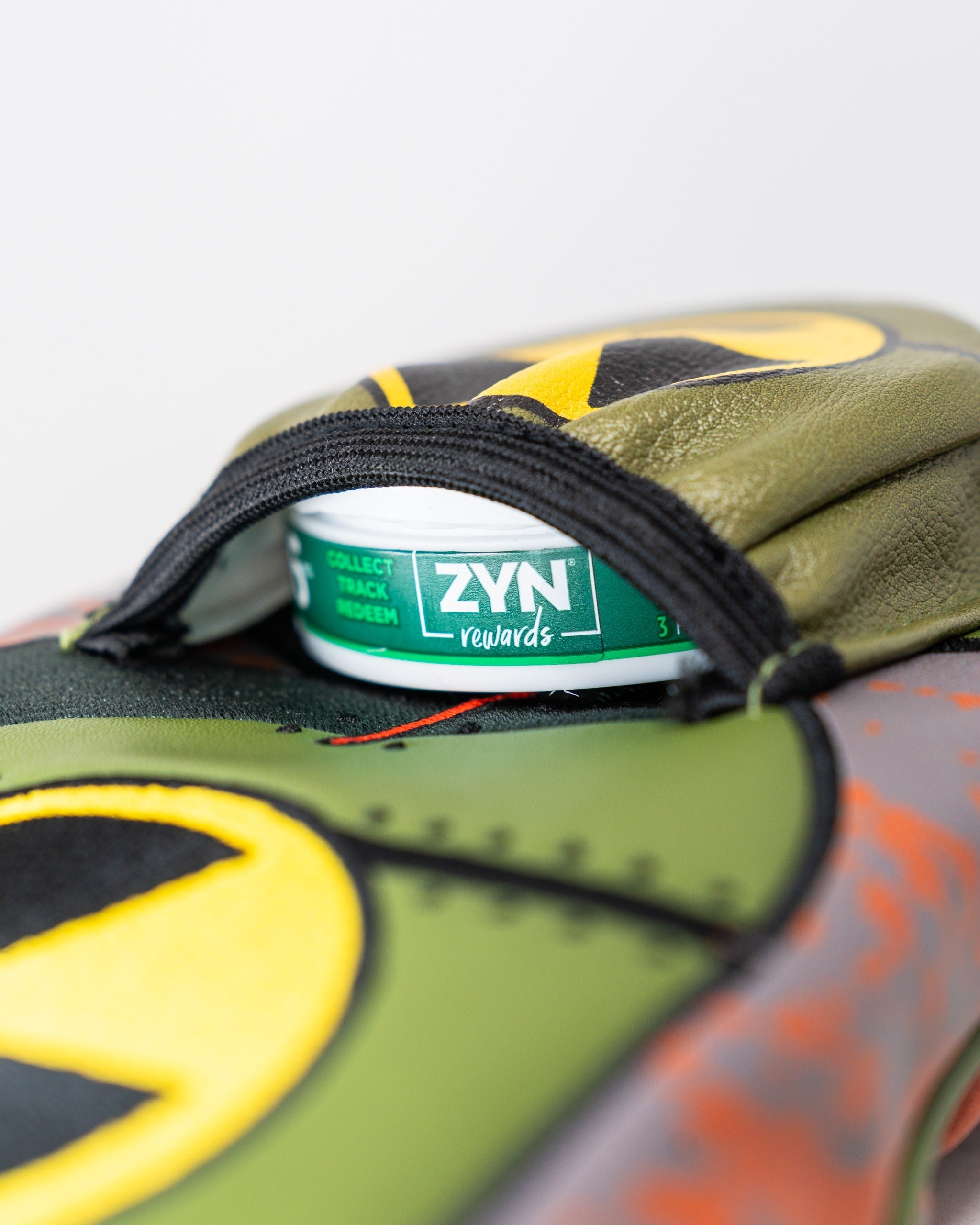 Bold driver cover featuring a vibrant design inspired by the Zynbabwe Nuclear Program, with a pocket for ZYN rewards.