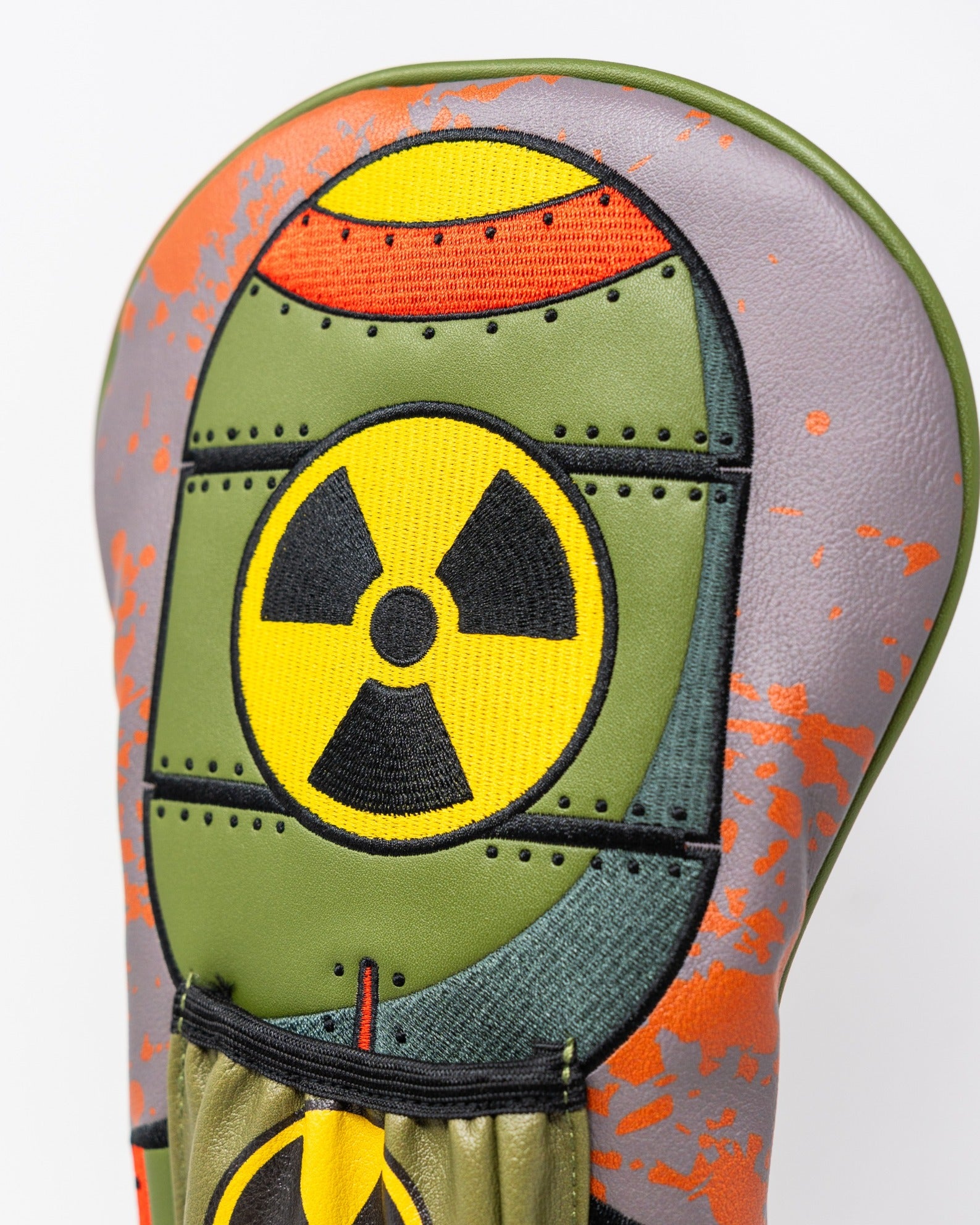 Bold driver cover featuring a nuclear theme with vibrant colors and a radiation symbol, perfect for standout golfers.