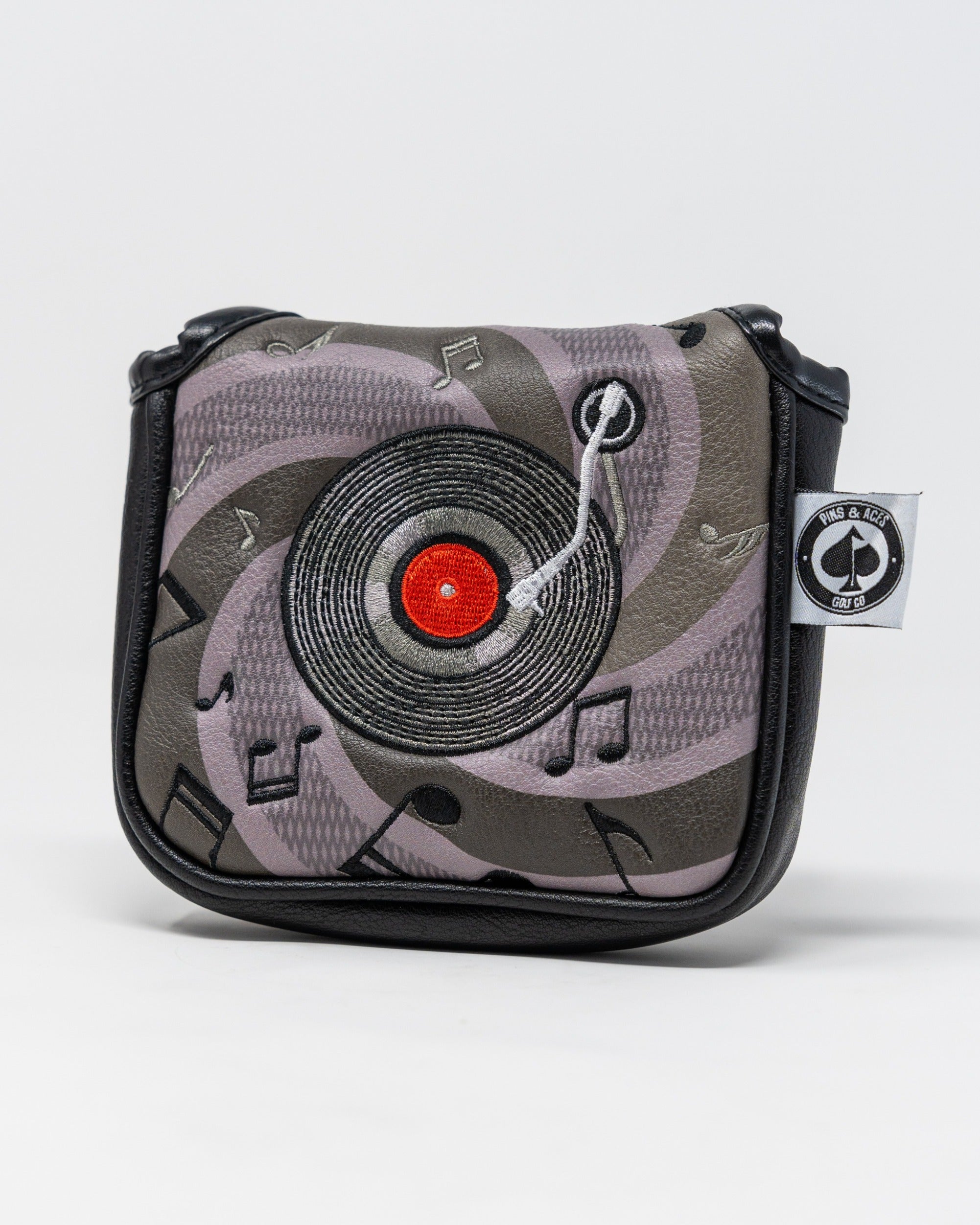 Mallet putter cover featuring a vinyl record design with musical notes, perfect for stylish golfers.