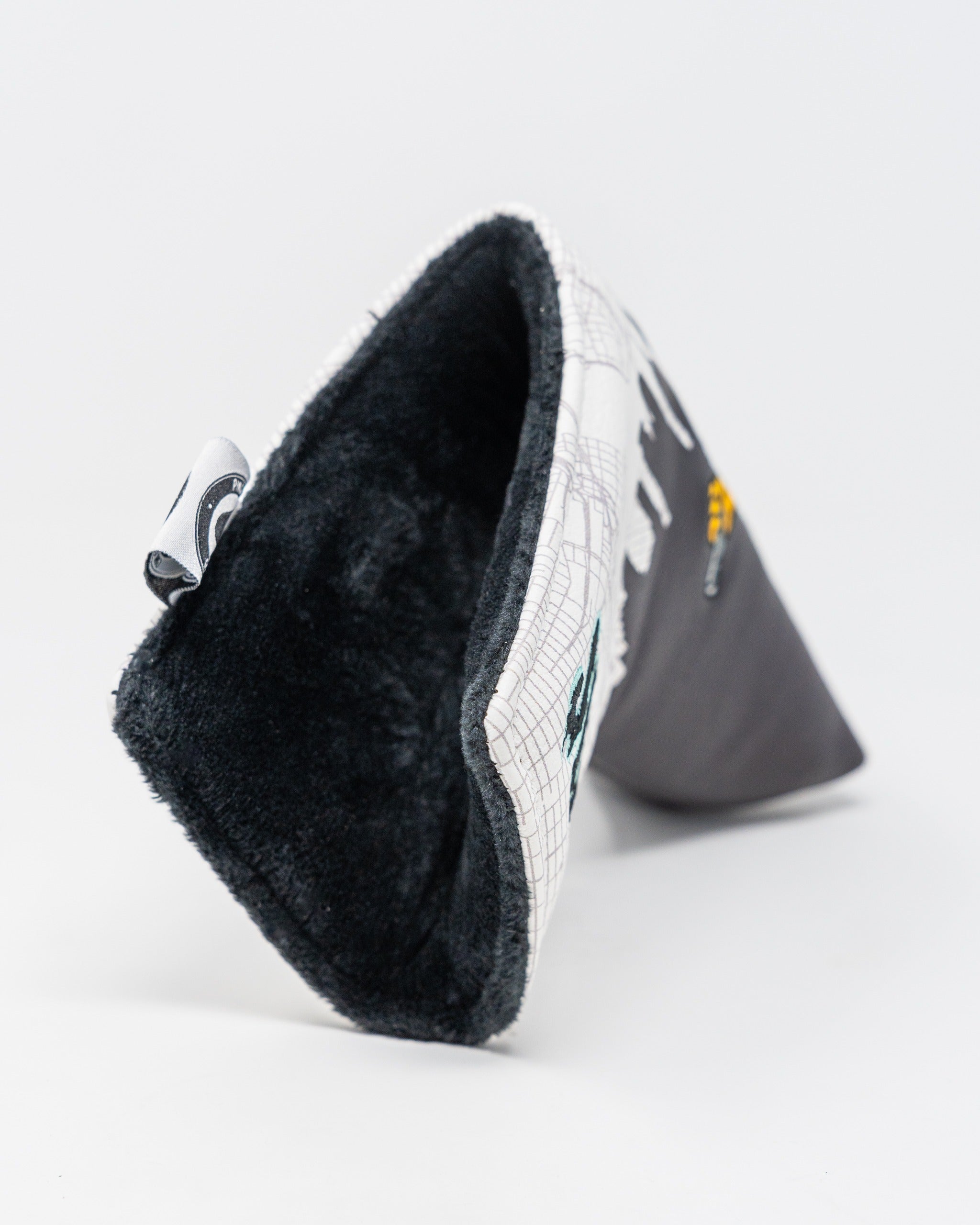 Stylish Shady Slice blade putter cover featuring a unique design and soft interior for optimal club protection.