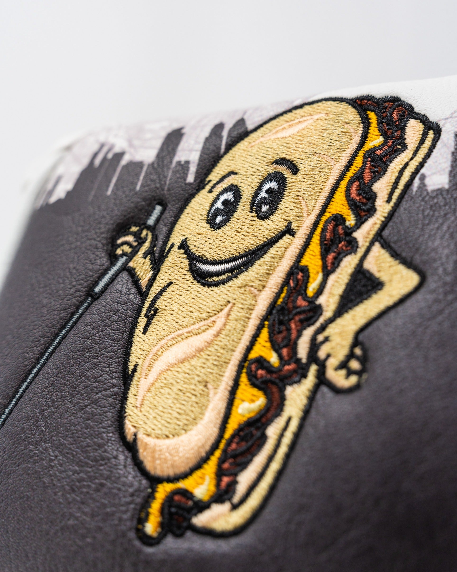 Whiz Wit mallet cover featuring a playful hot dog character with a smiling face and golf club, perfect for unique golf style.