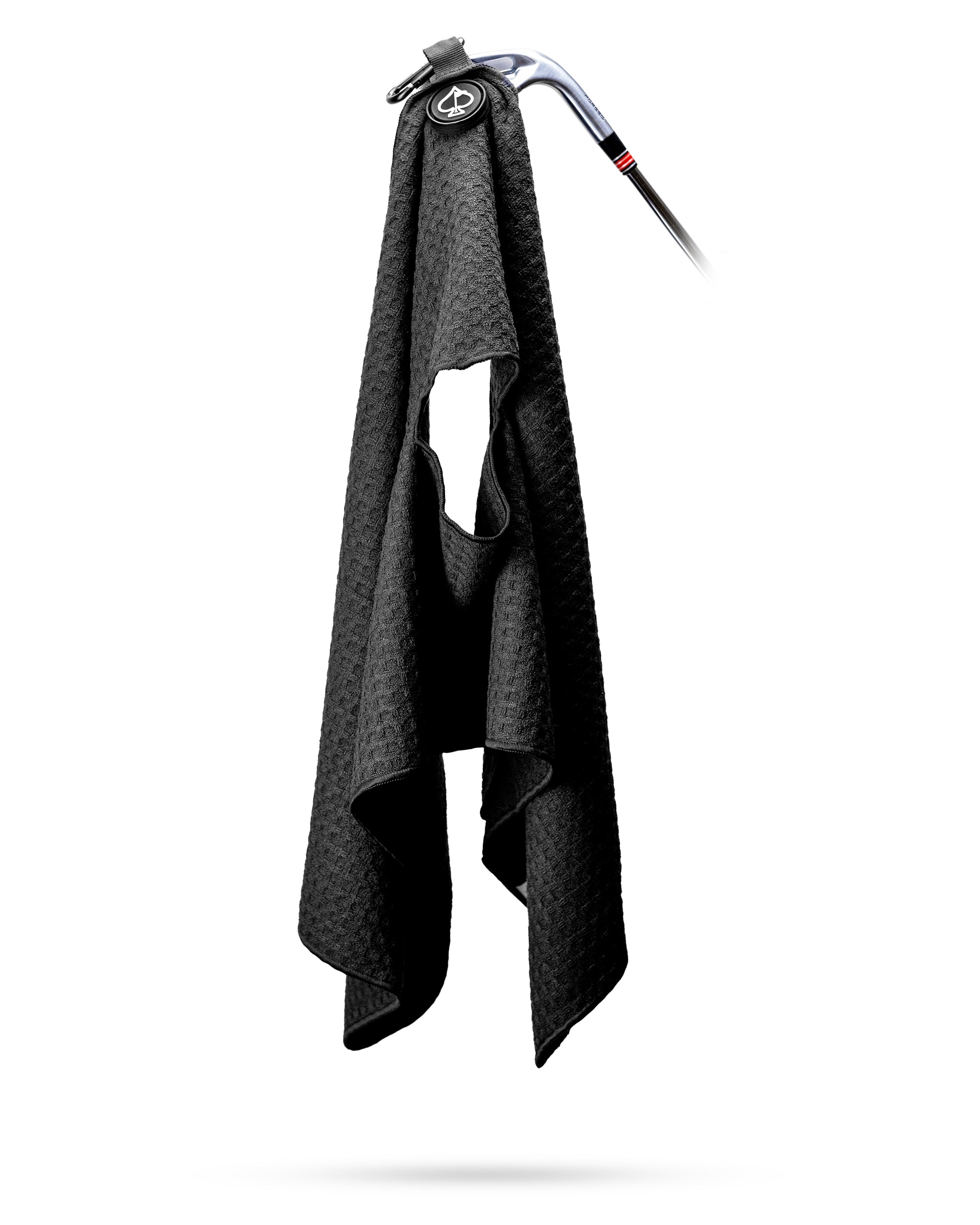 Black magnetic golf towel hanging from a club, featuring a textured design for effective cleaning on the course.