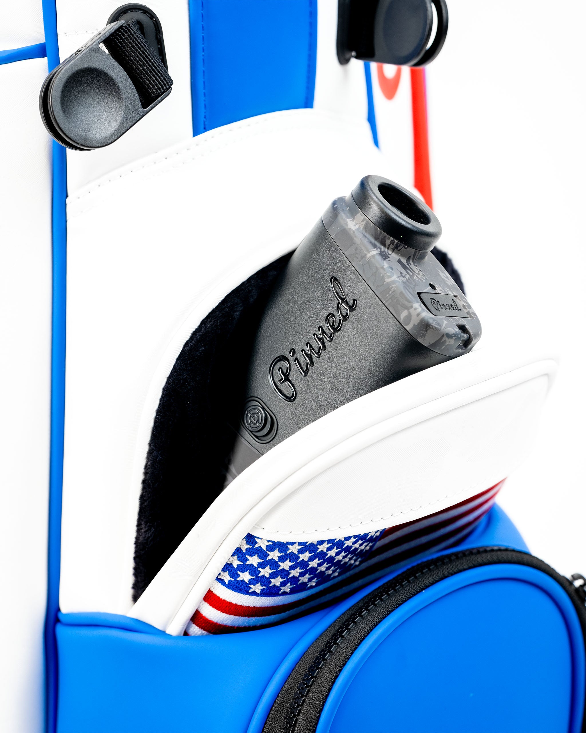 Close-up of a Player Preferred golf bag featuring a pocket with a golf accessory and patriotic design elements.