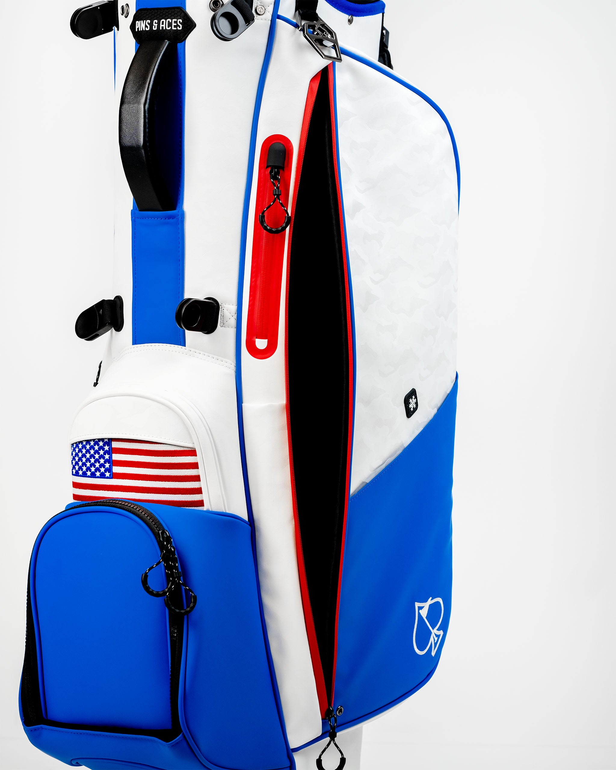 Player Preferred Golf Bag in blue and white with red accents, featuring an American flag patch and spacious pockets.