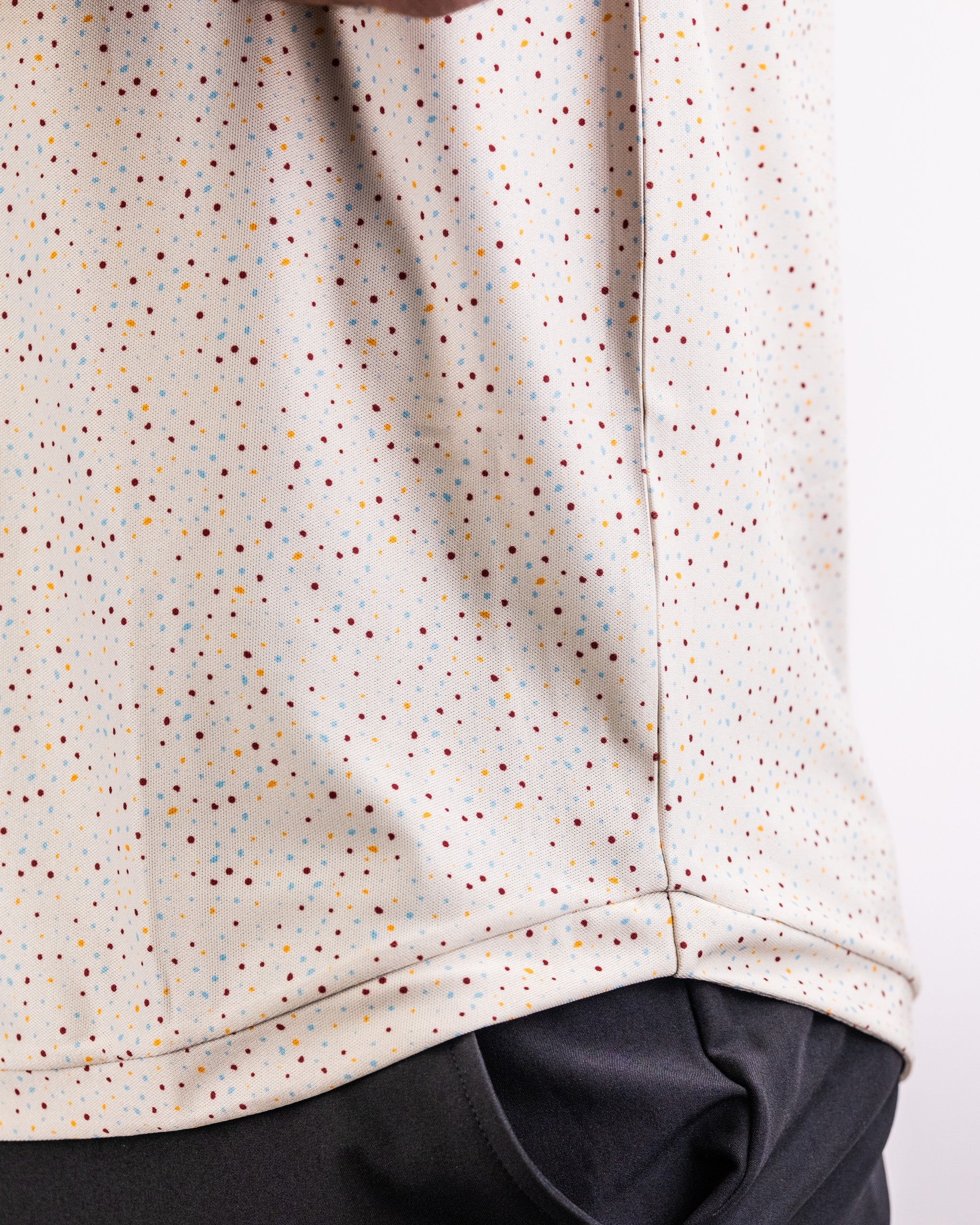 Player Preferred Polo in Terrazzo features a stylish speckled pattern, perfect for golfers seeking a unique look on the course.
