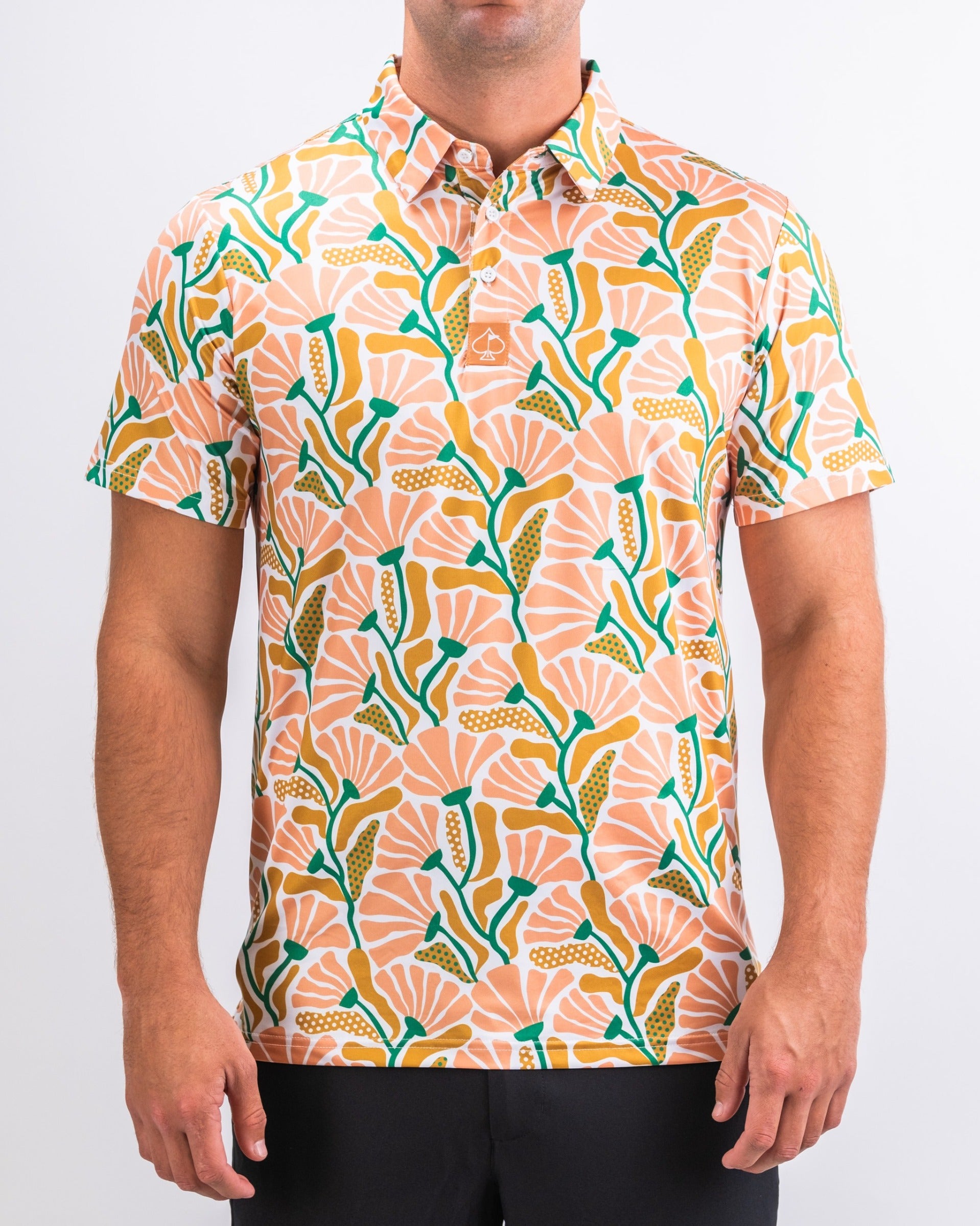 Men's short-sleeve shirt featuring a vibrant floral pattern in shades of pink, green, and orange, perfect for summer outings.