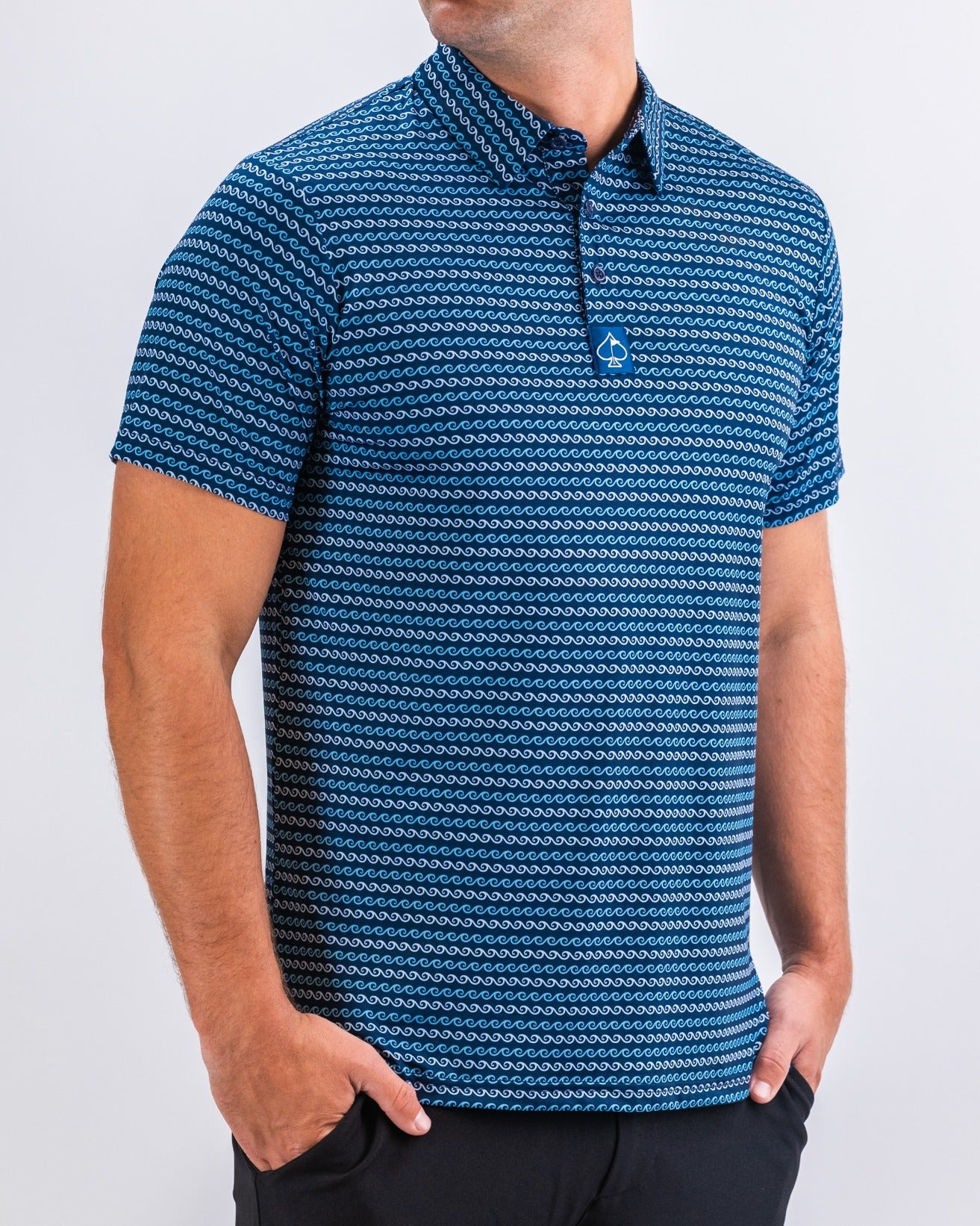 Men's short-sleeve golf polo in blue with a wave pattern, designed for comfort and style on the course.