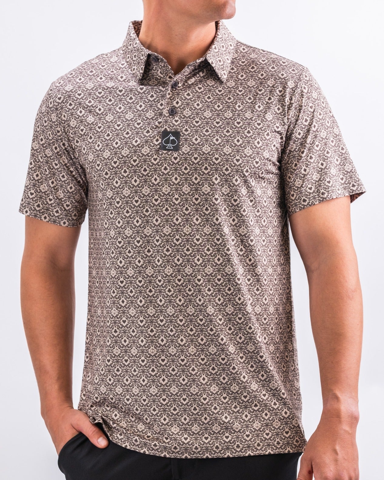 Men's Big Blind Ash golf polo featuring a unique pattern in earthy tones, designed for stylish performance on the course.
