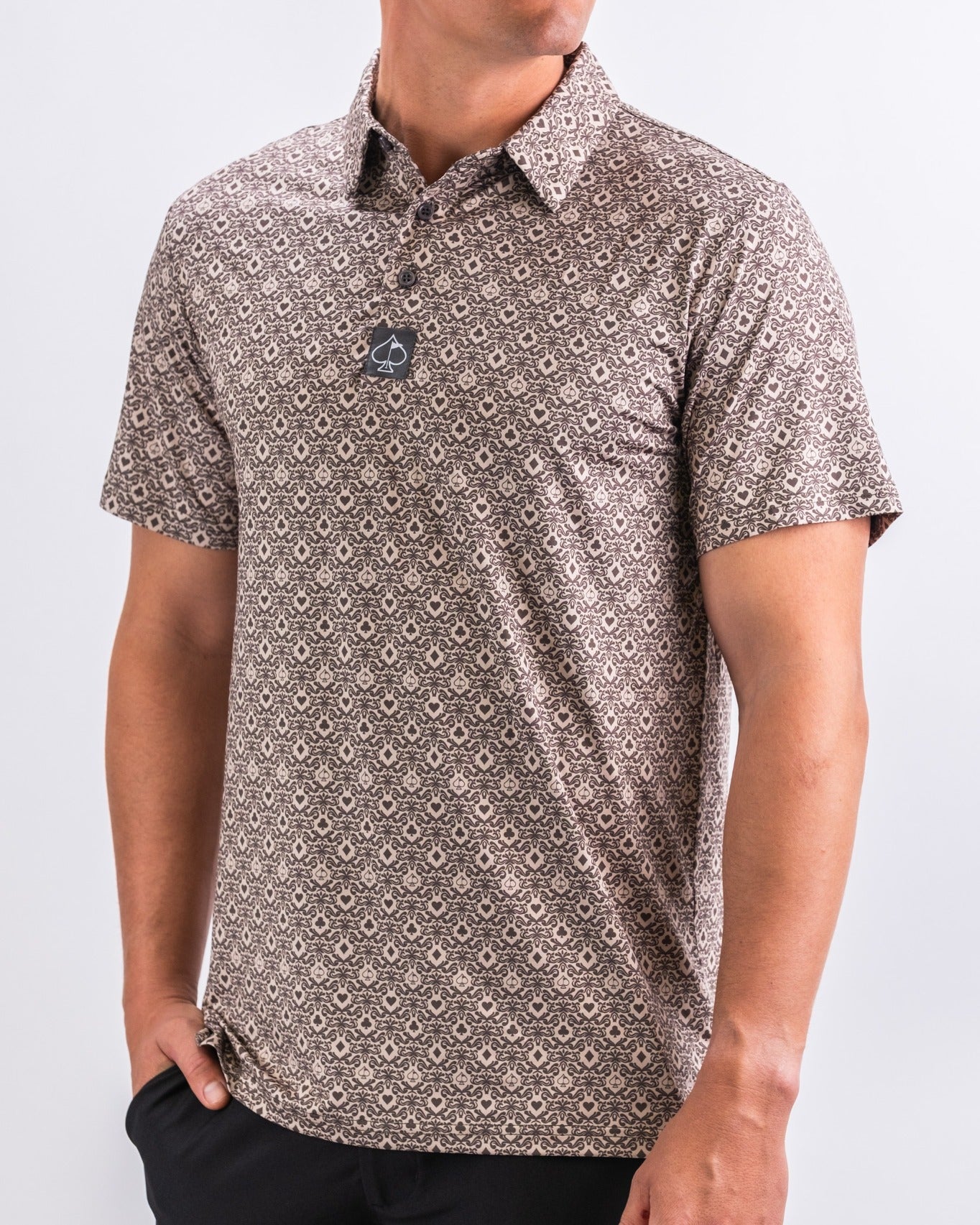Men's short-sleeve golf shirt featuring a bold geometric pattern in earthy tones, designed for style on the course.