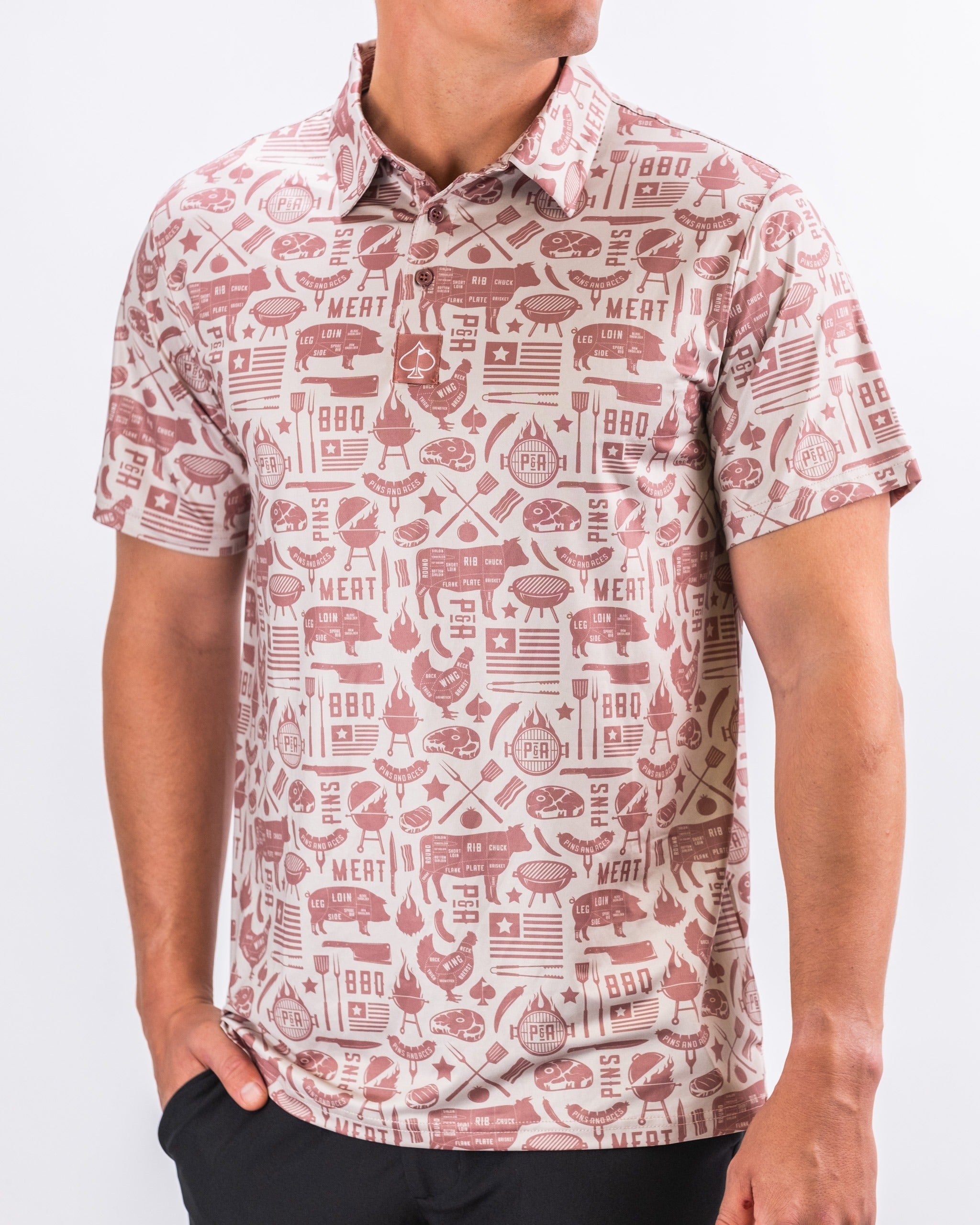 Men's Pitmaster golf shirt featuring a bold barbecue-themed print with grills, meats, and flames, perfect for stylish golfers.