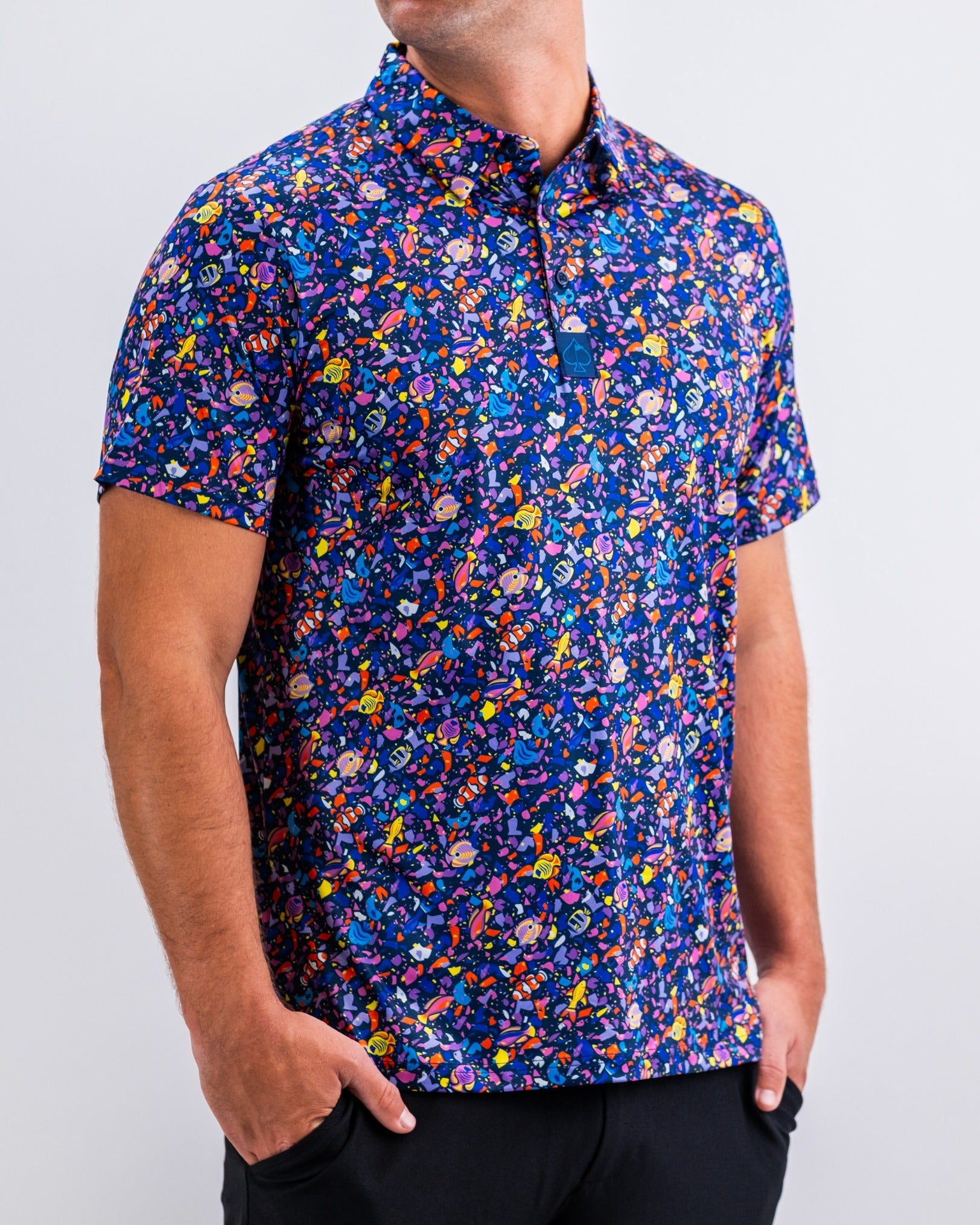 Bold tropical print golf polo shirt featuring vibrant colors and a modern fit, perfect for making a statement on the course.
