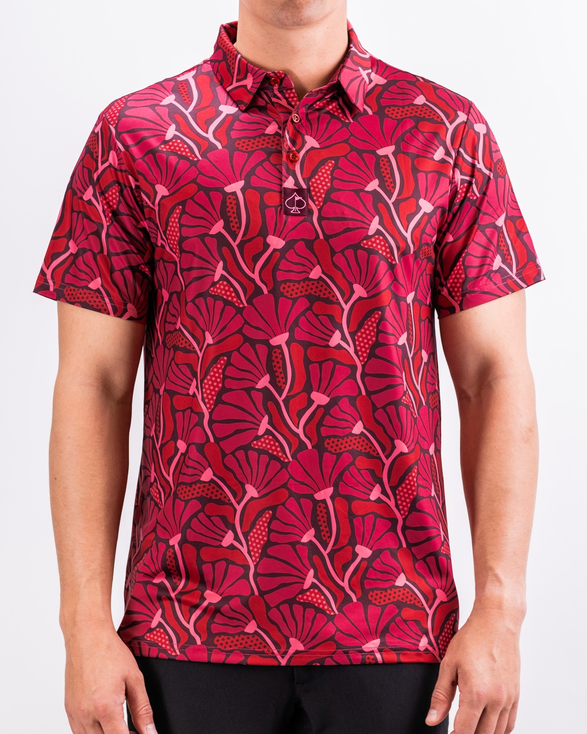 Men's short-sleeve polo shirt featuring a vibrant crimson floral pattern, perfect for stylish golf outings.