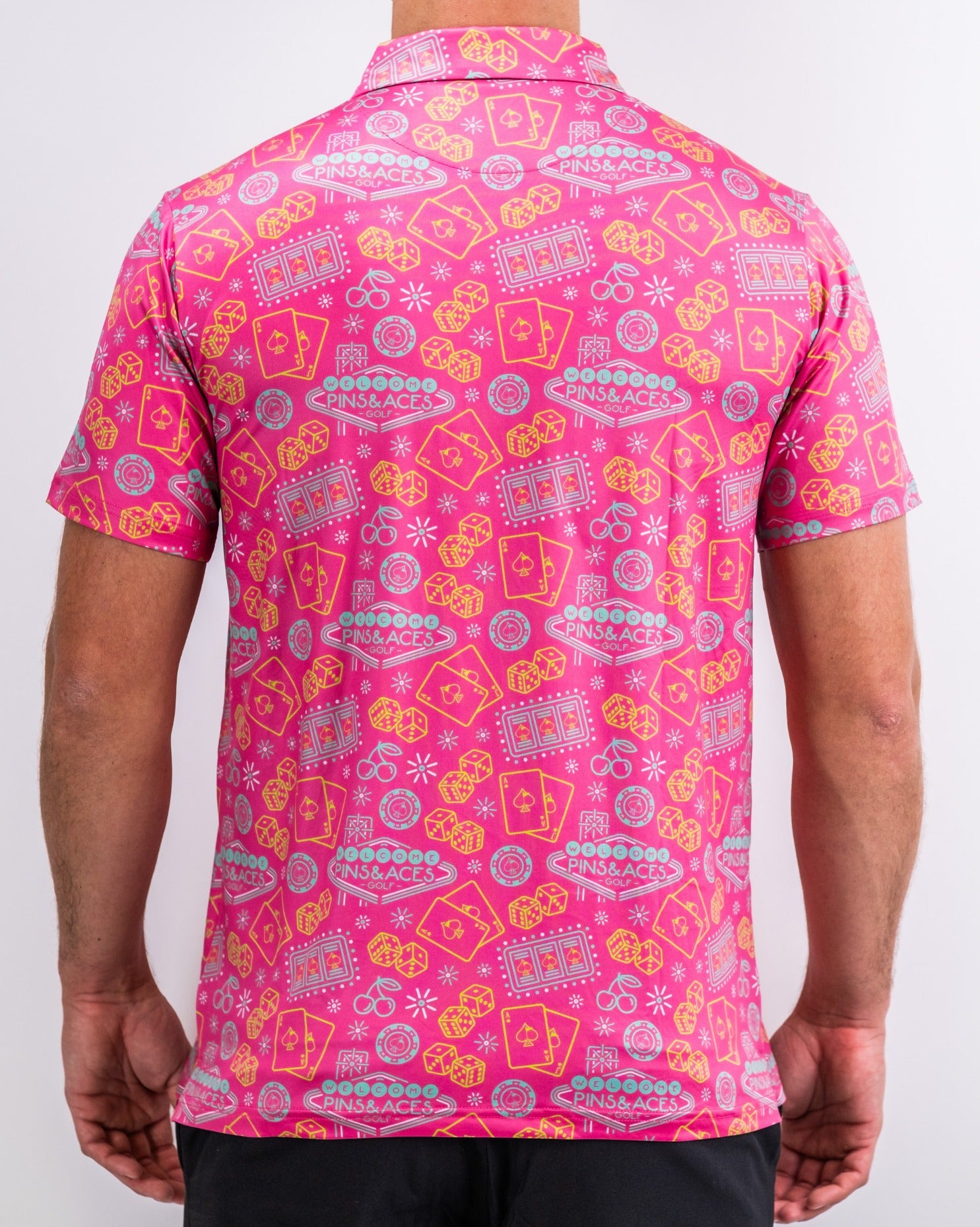 Bold fuchsia golf shirt featuring a playful pattern of golf-themed graphics, perfect for making a statement on the course.