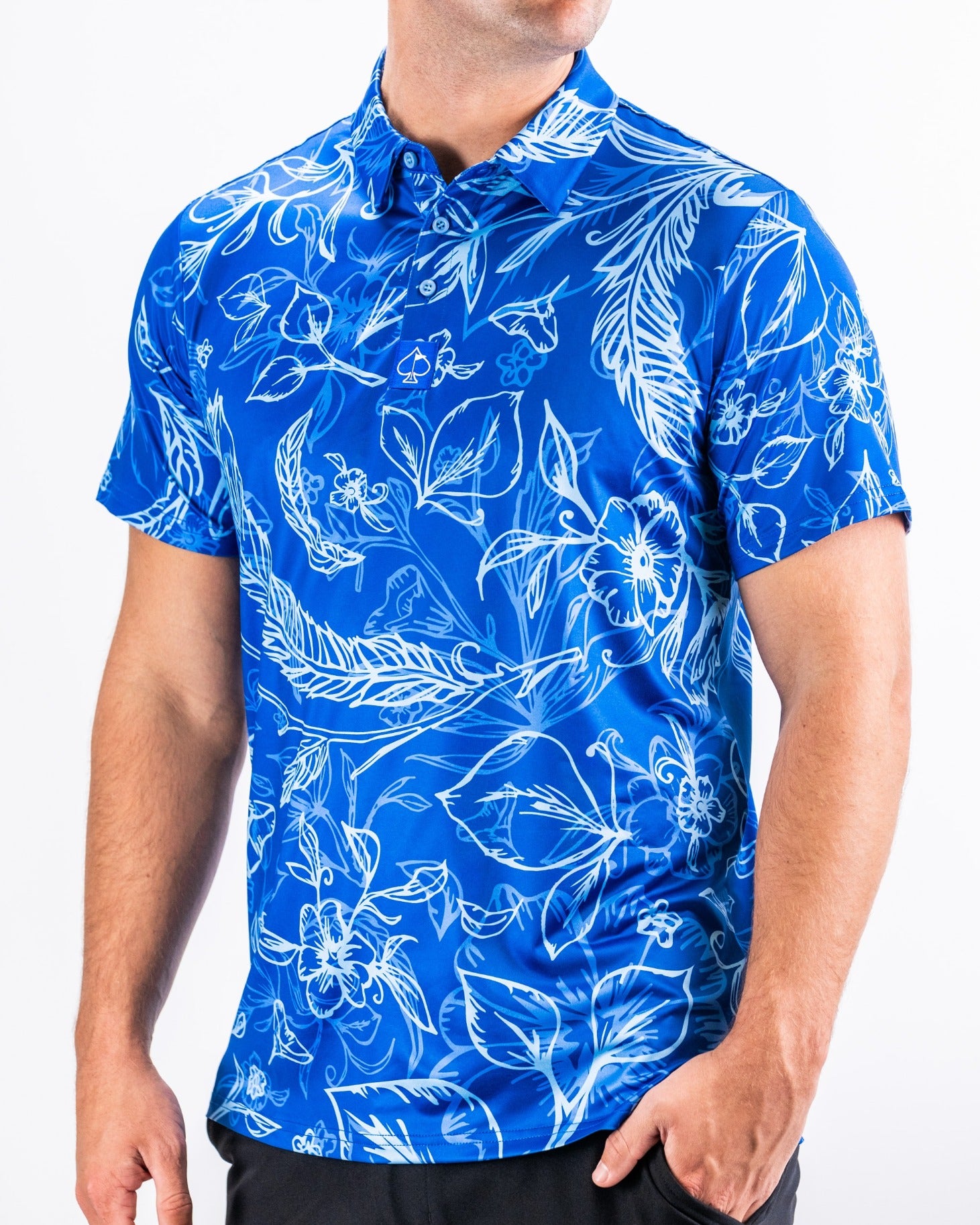 Bold blue short-sleeve golf shirt featuring a vibrant floral pattern, perfect for stylish performance on the course.