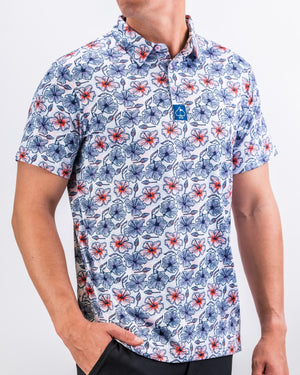 Men's golf polo shirt featuring a vibrant hibiscus floral pattern in red, blue, and white, perfect for stylish play on the course.
