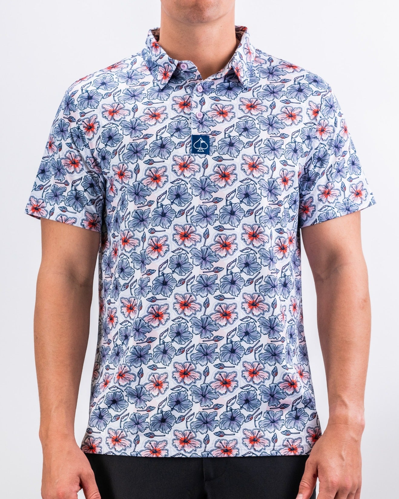 Men's short-sleeve golf shirt featuring a vibrant hibiscus floral pattern in red, blue, and white tones.
