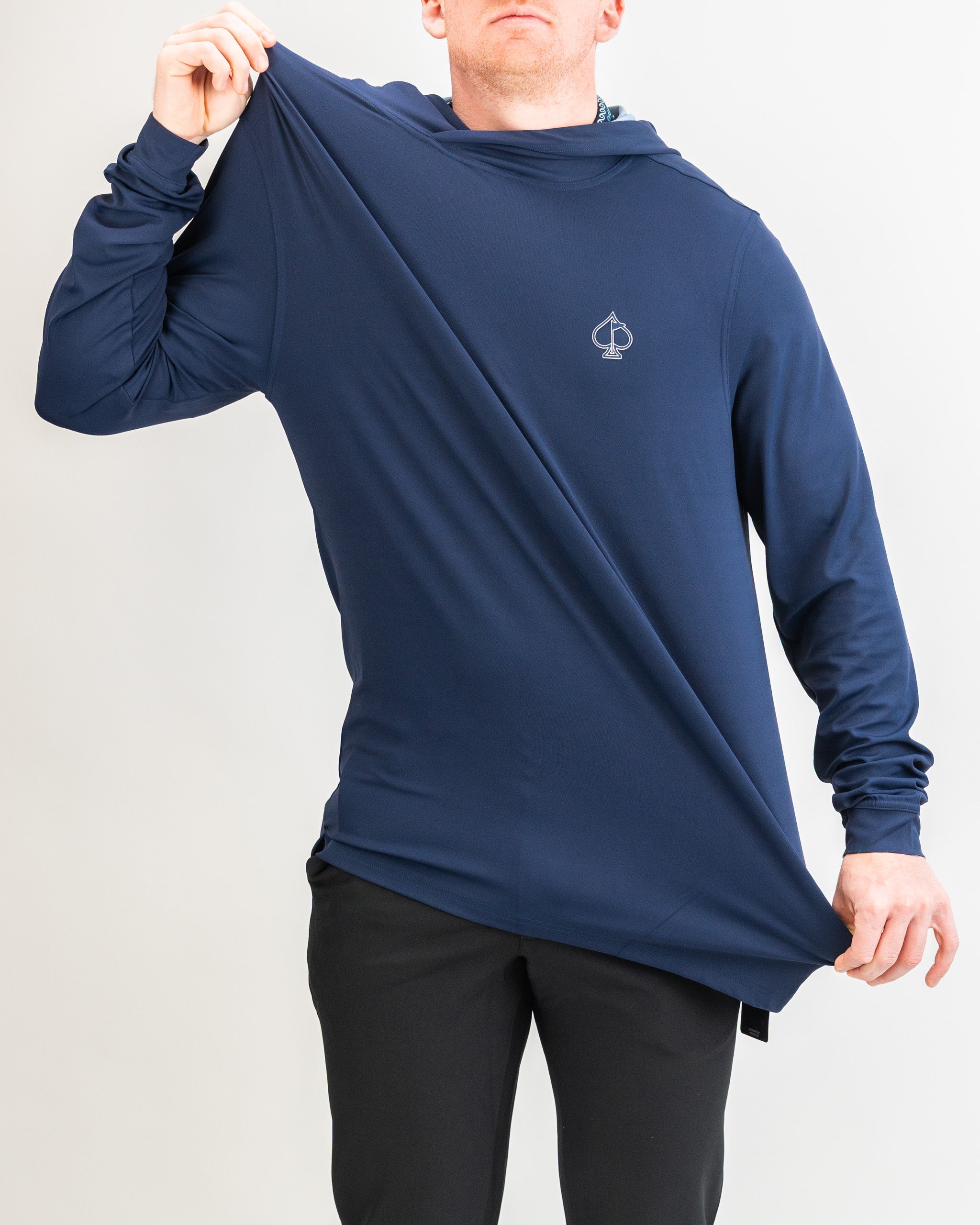 Navy performance golf hoodie being showcased by a model, highlighting its stylish design and comfortable fit.