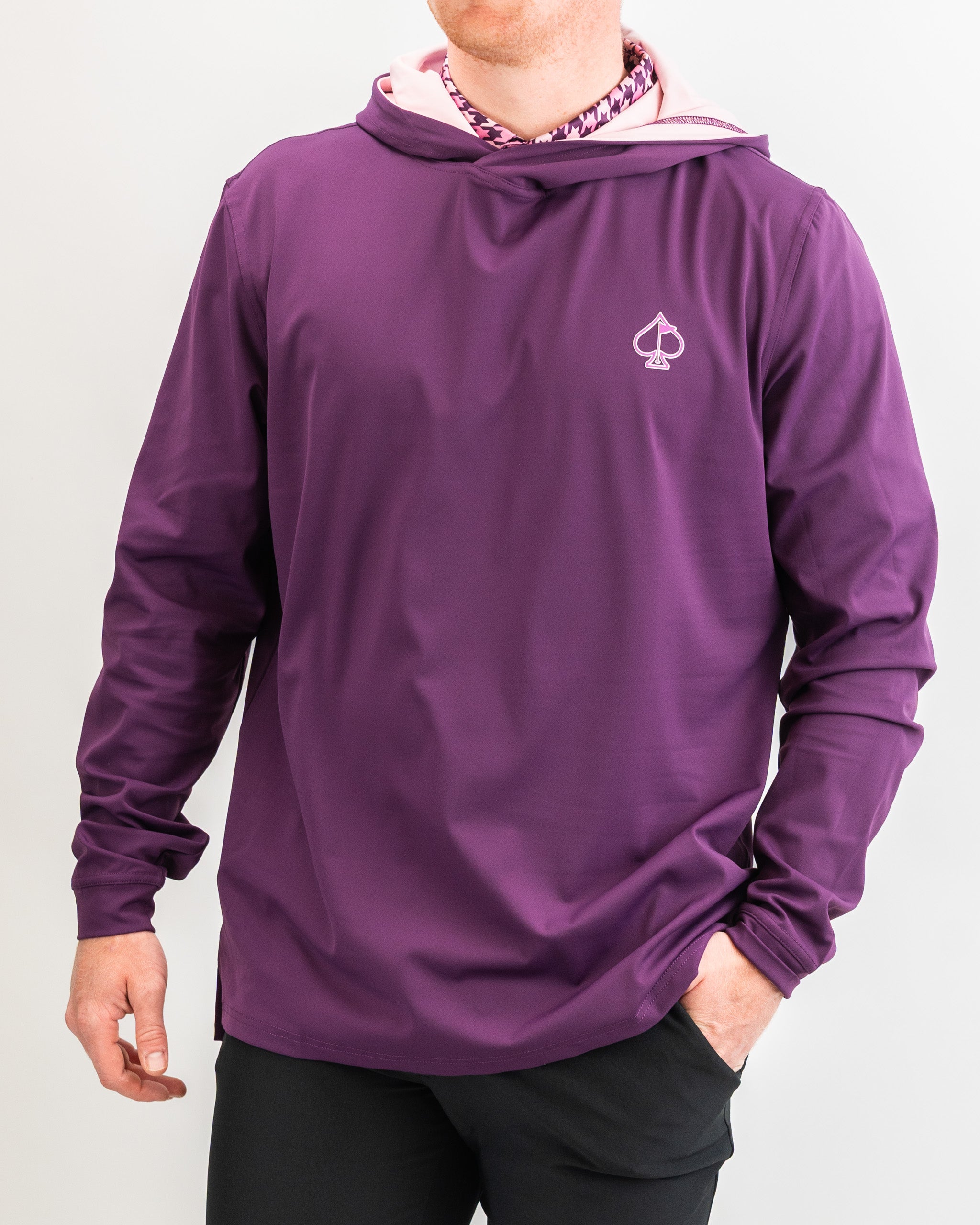Men's performance golf hoodie in houndstooth raspberry, featuring a stylish design and lightweight, breathable fabric.