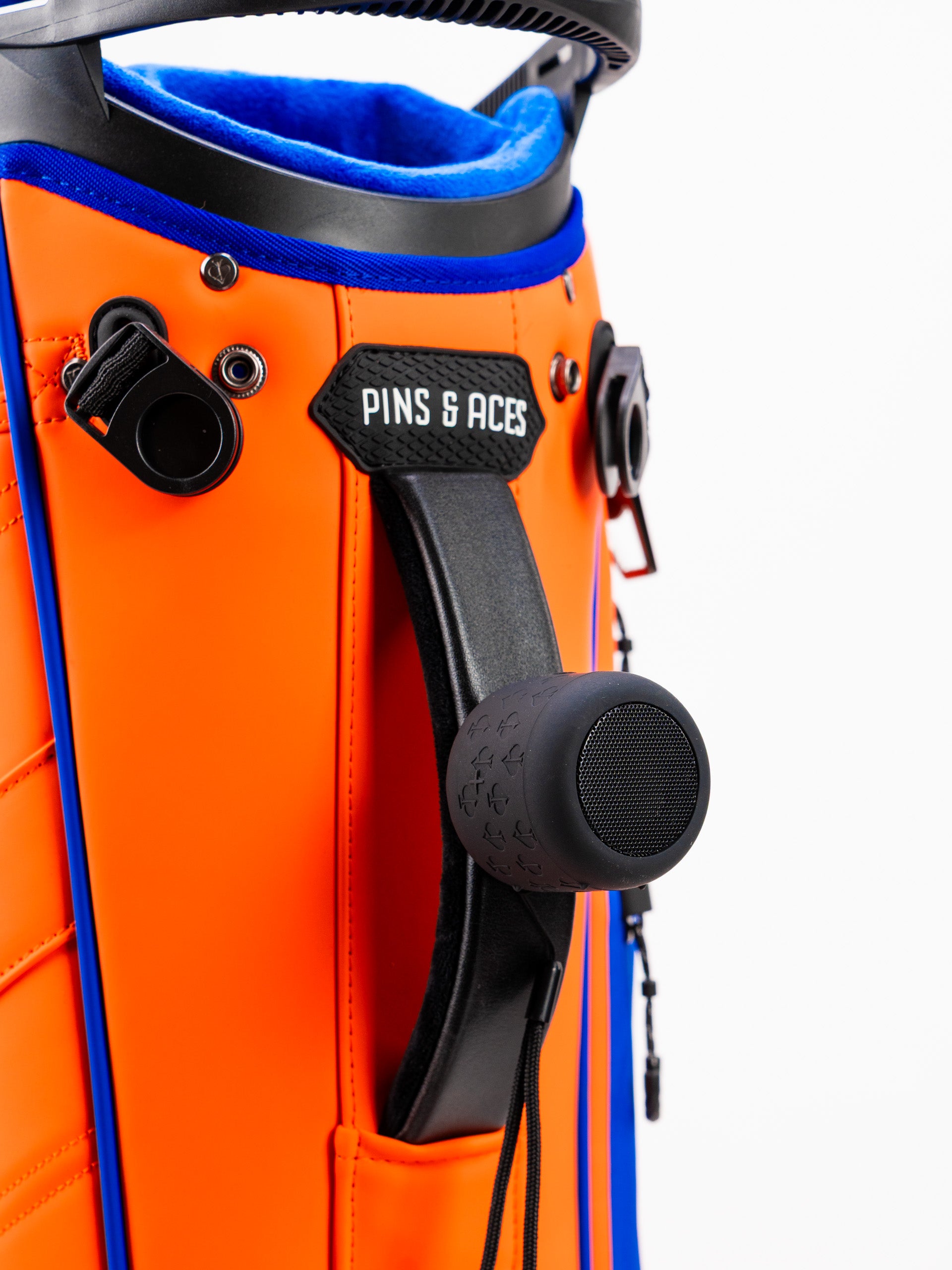 Close-up of the Player Preferred Golf Bag in Orange Crush, showcasing vibrant orange material and a black handle.