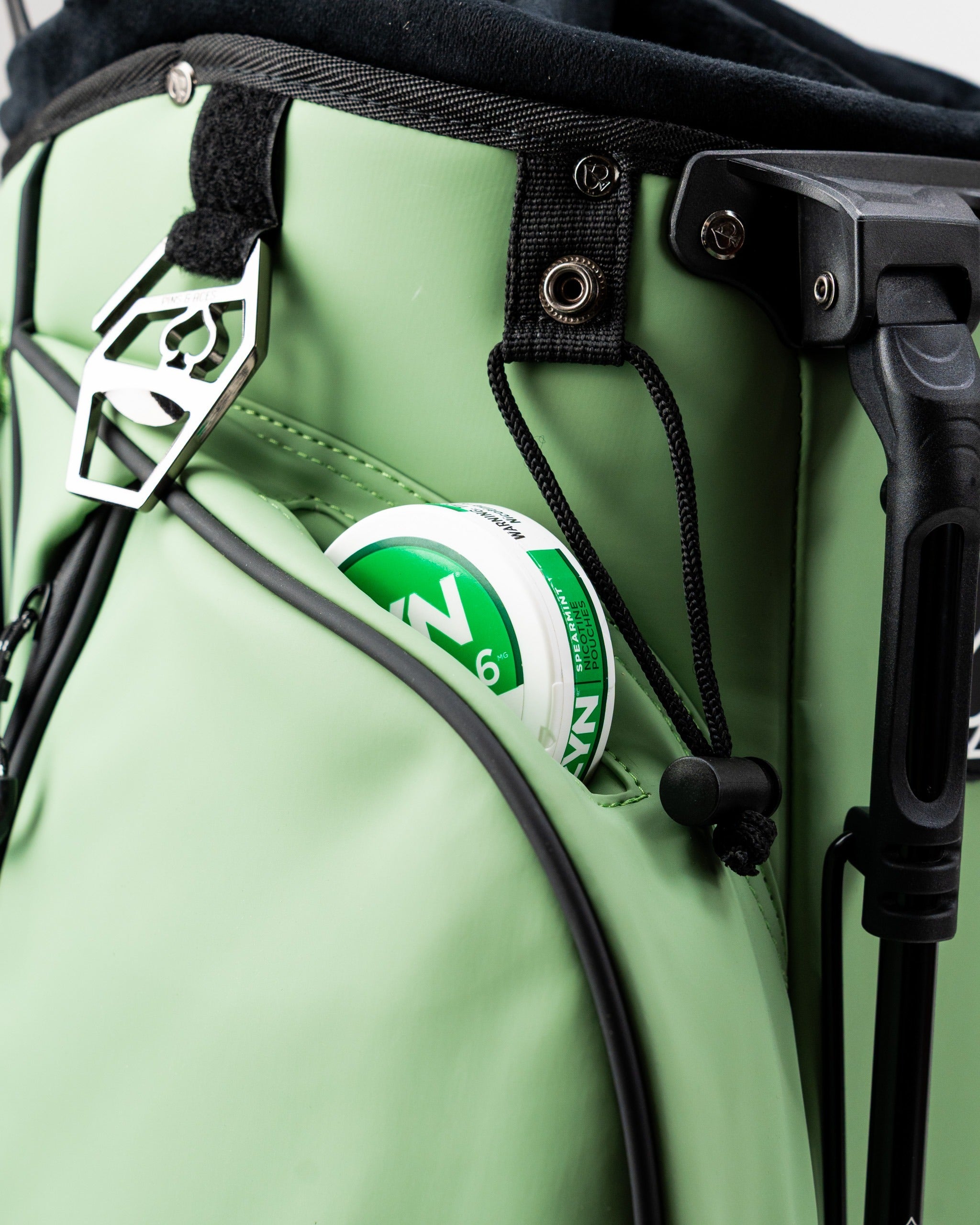 Player Preferred Golf Bag in sage green featuring a convenient pocket with a canister, perfect for on-course essentials.
