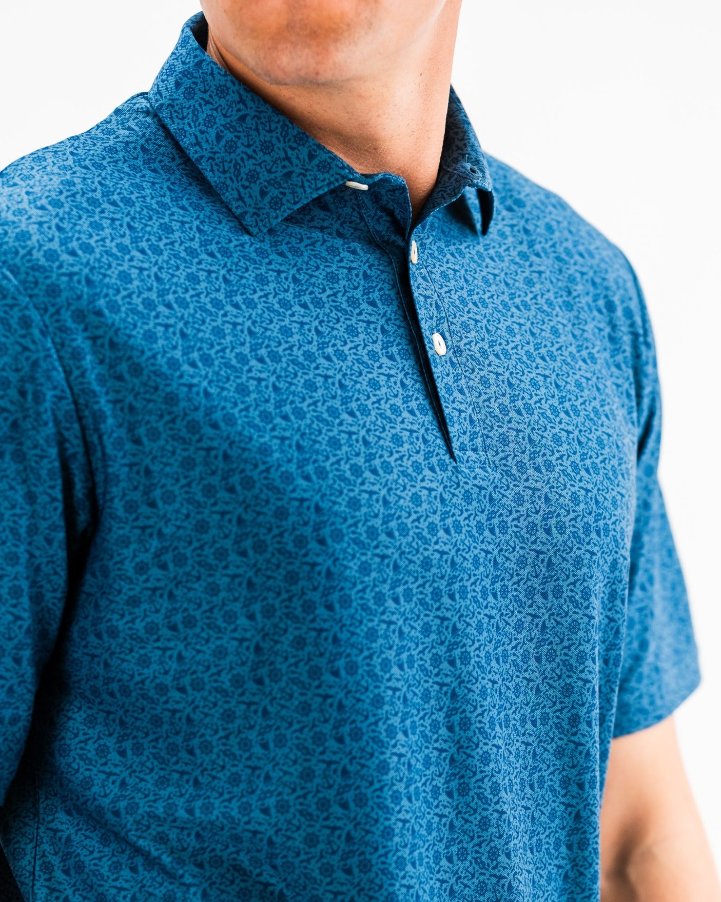 Men's Player Preferred Polo in blue with a subtle pattern, designed for comfort and style on the golf course.