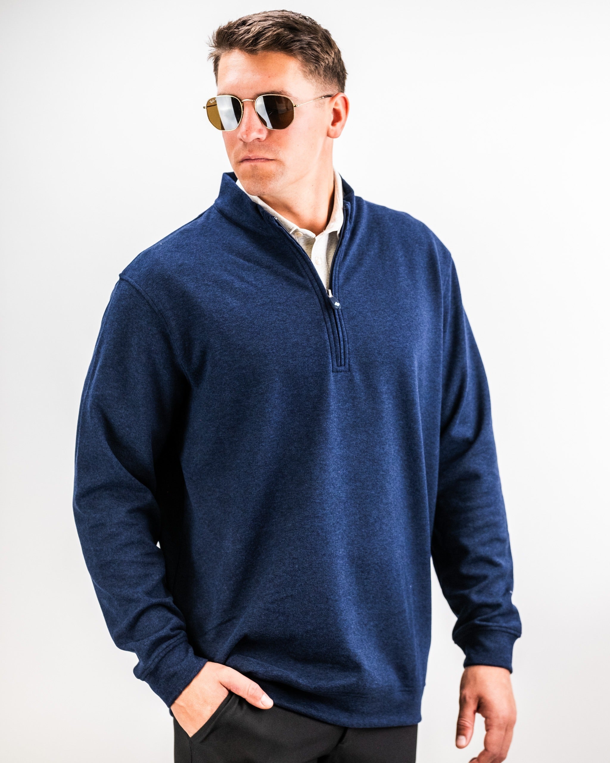 Men's Player Preferred Pullover in heathered navy, featuring a quarter-zip design and a relaxed fit for stylish comfort on the course.