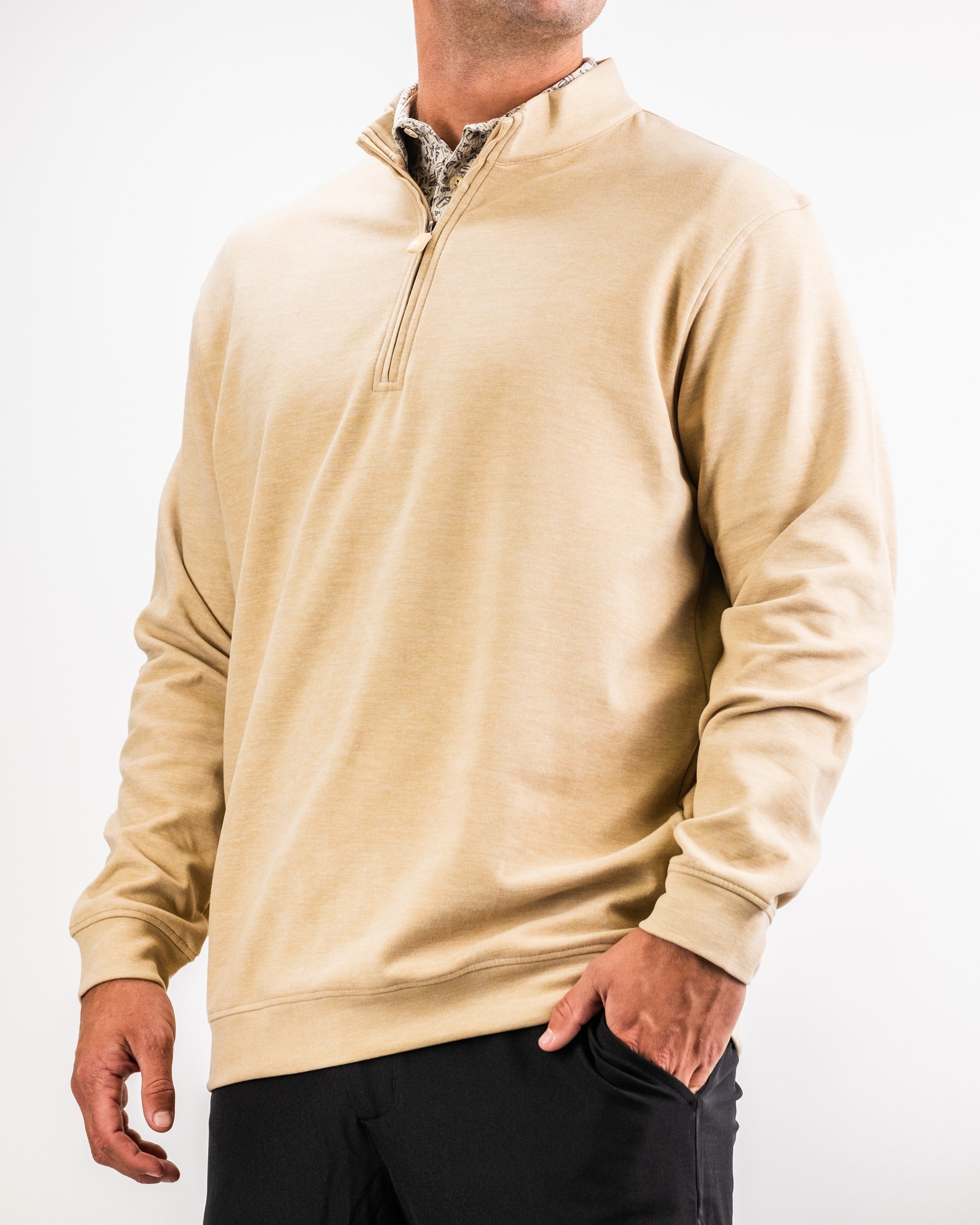Men's Player Preferred Pullover in sand color, featuring a half-zip design and a relaxed fit for comfortable golfing.
