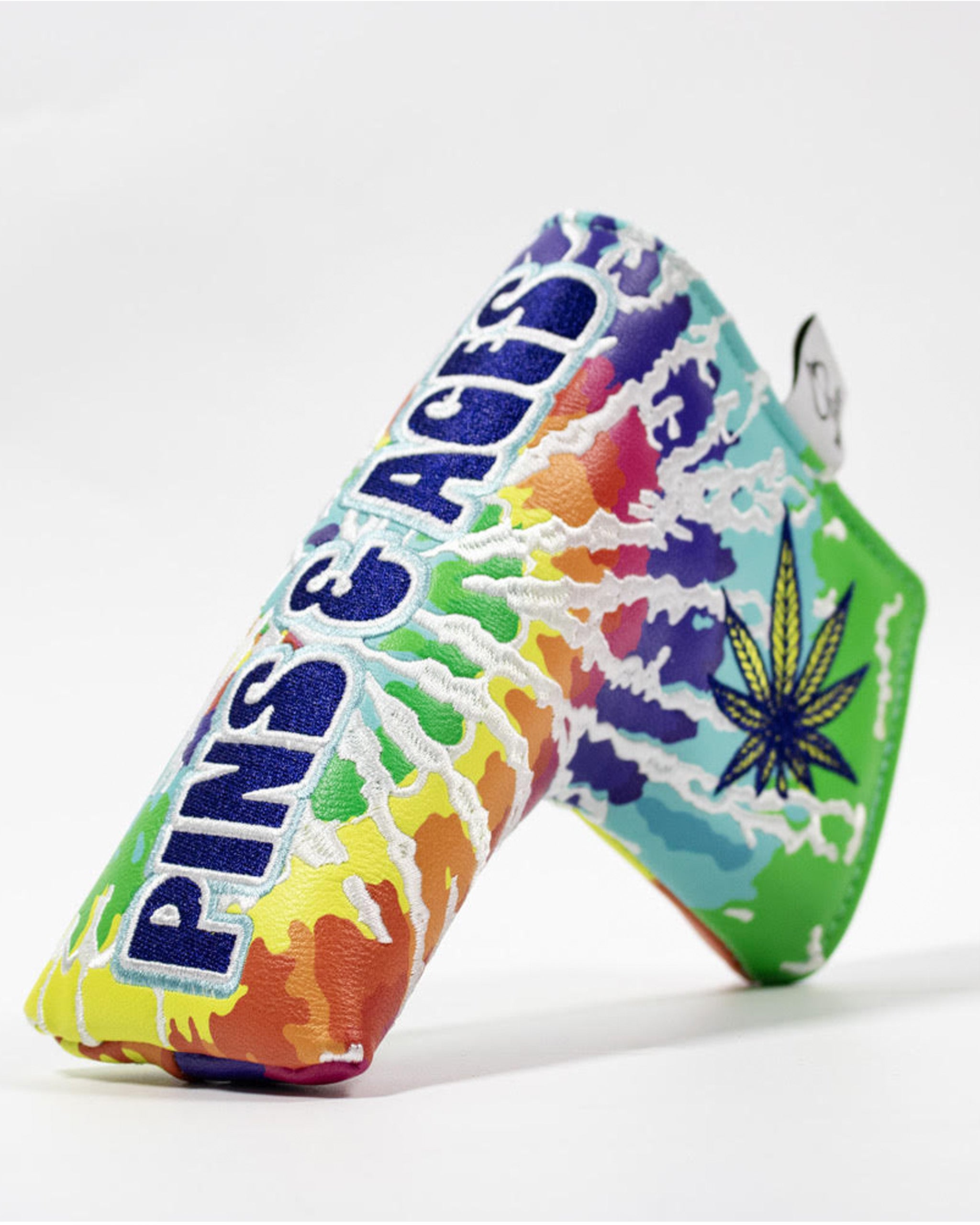 Colorful blade putter cover featuring a vibrant tie-dye design and the text "Pins & Aces" for a bold golf statement.