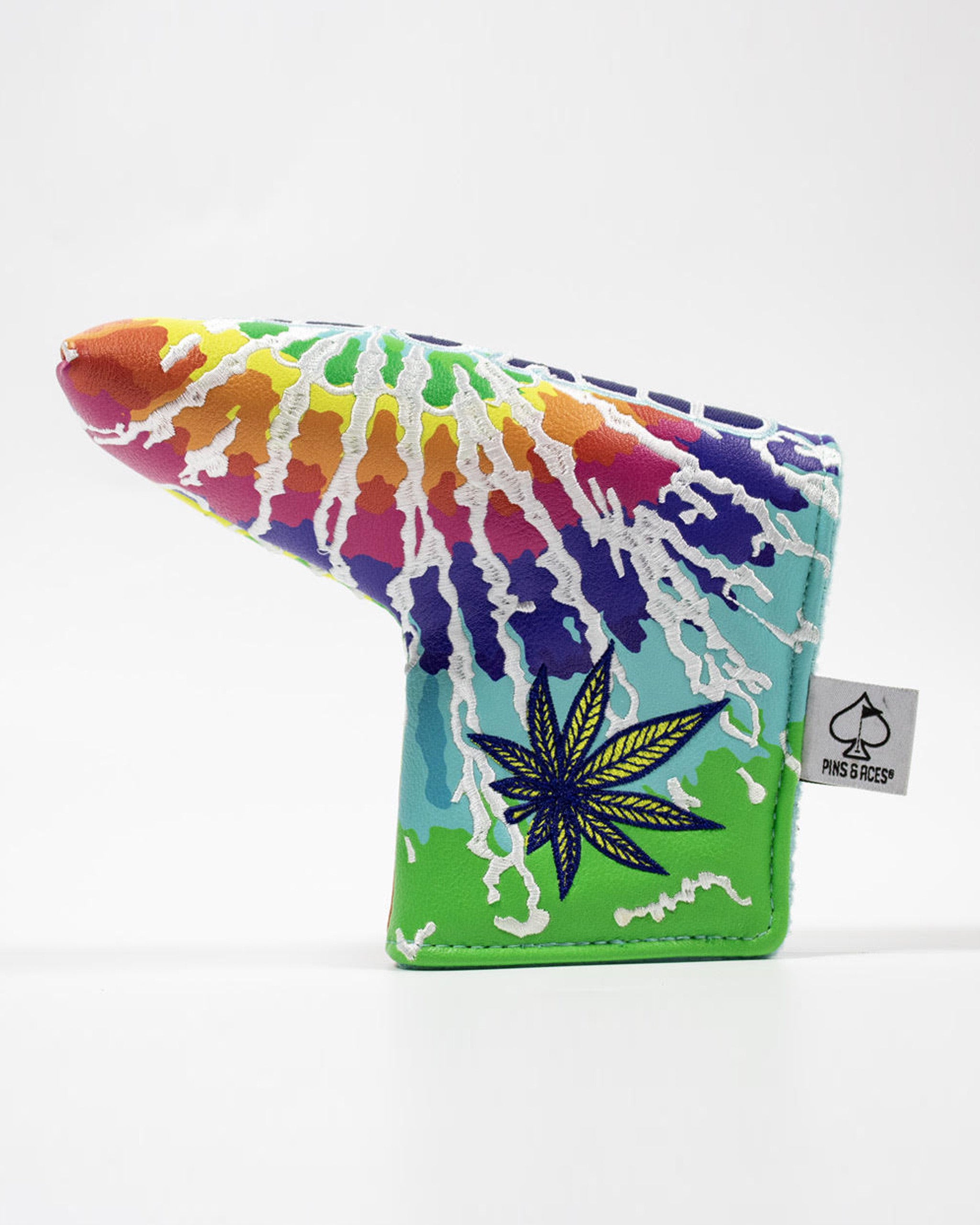 Vibrant blade putter cover featuring a colorful tie-dye design and a leaf graphic, perfect for stylish golfers.