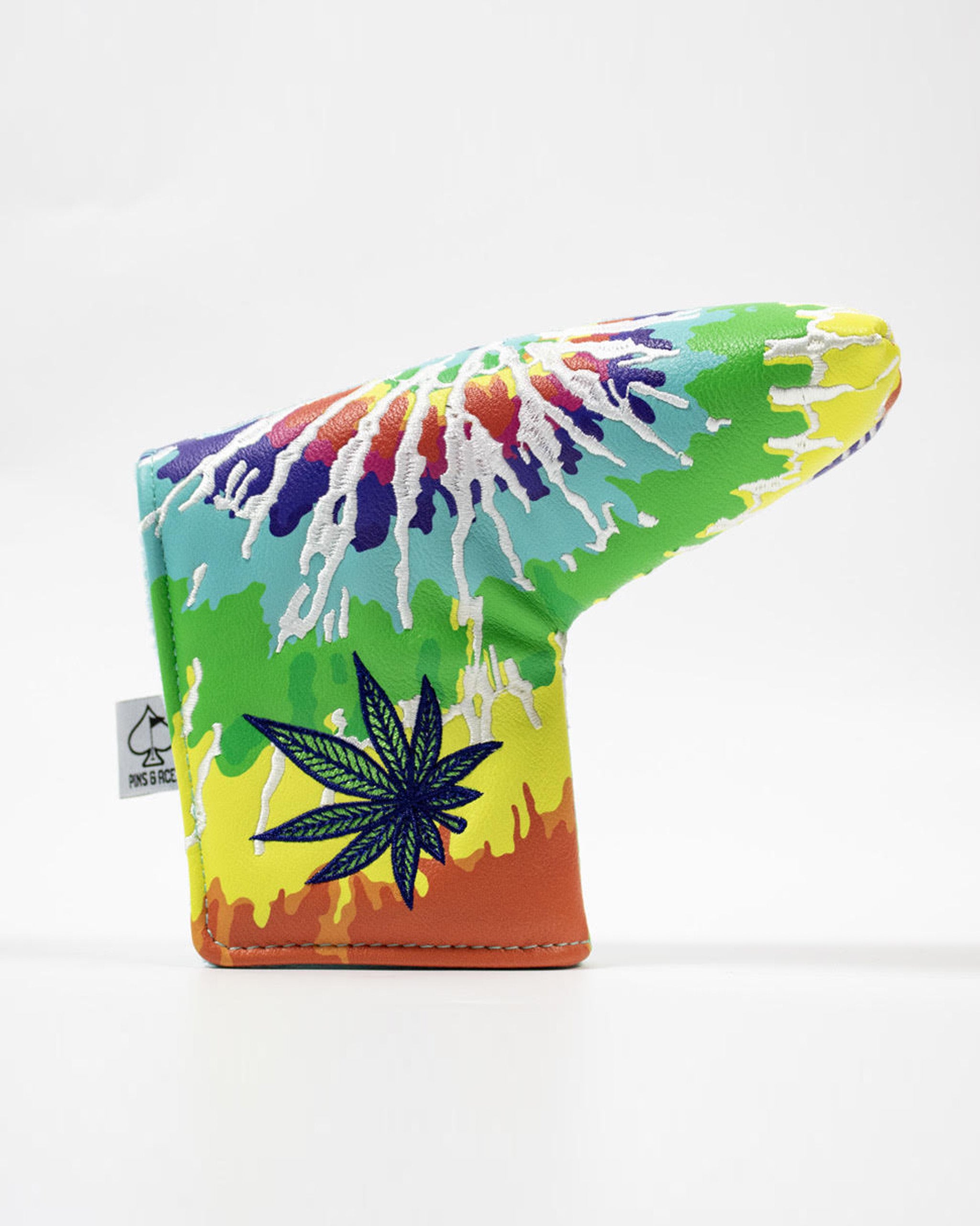 Colorful blade putter cover featuring a tie-dye design and a leaf motif, perfect for golfers seeking a bold style.