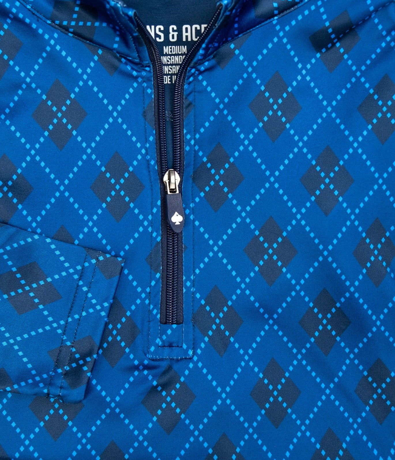 Windsor Blue Pullover featuring a stylish diamond pattern and a quarter-zip design for a modern golf look.