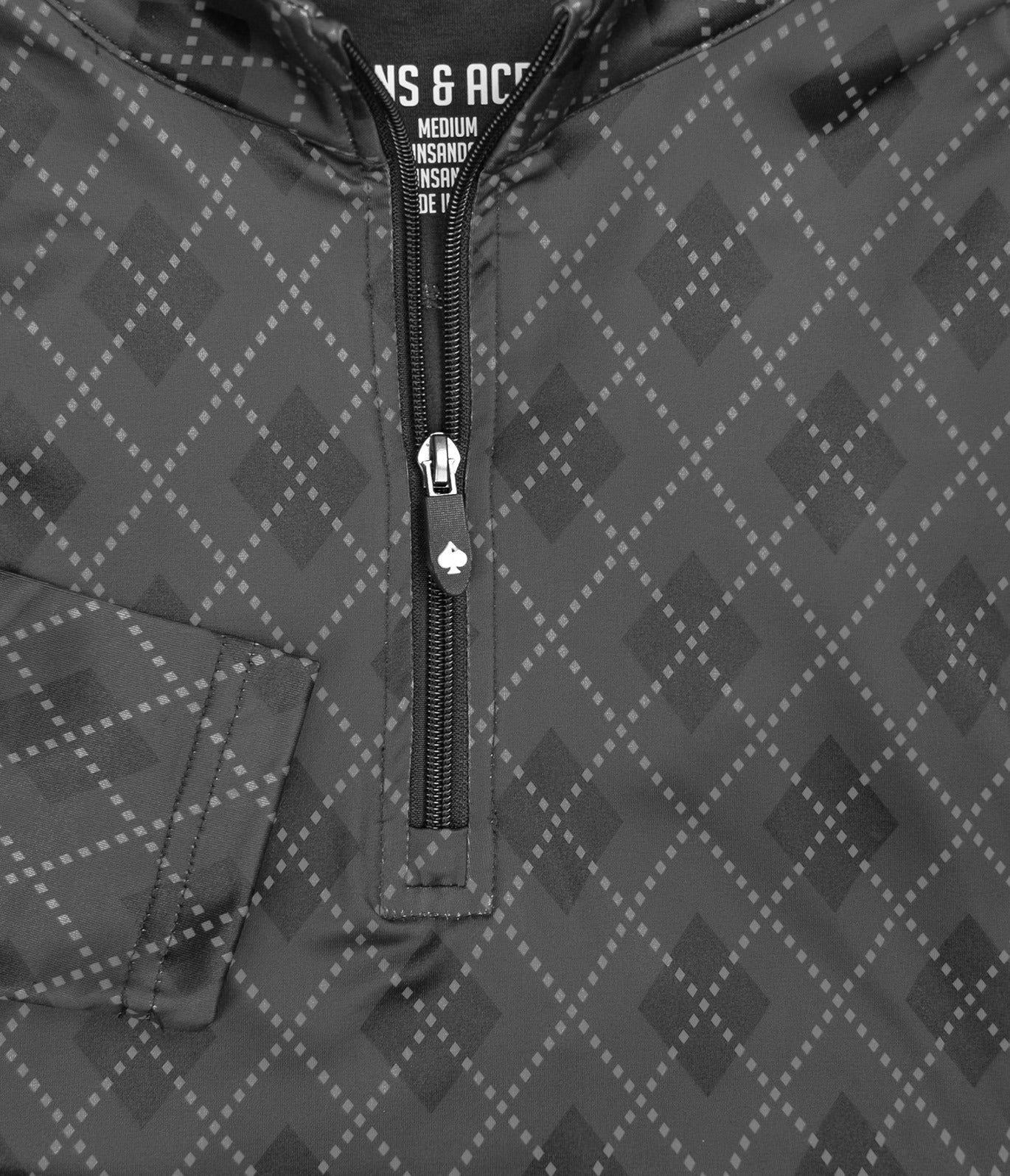 Stylish London Fog pullover featuring a quarter-zip design and a modern geometric pattern, perfect for golfers.