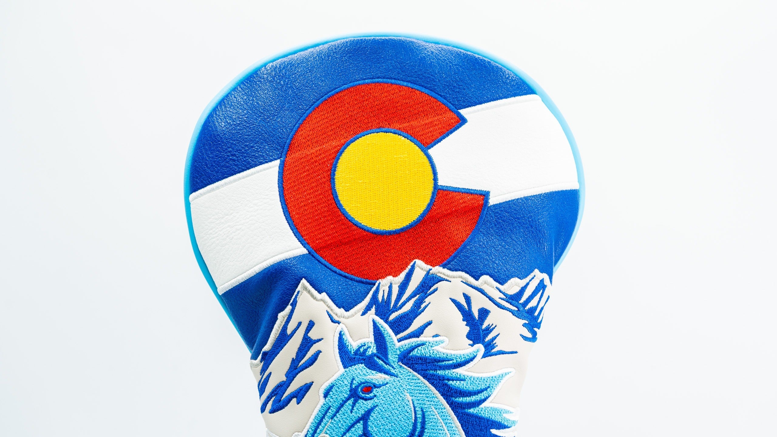 Bold driver cover featuring a blue horse design and Colorado state flag colors, perfect for golfers wanting to stand out.
