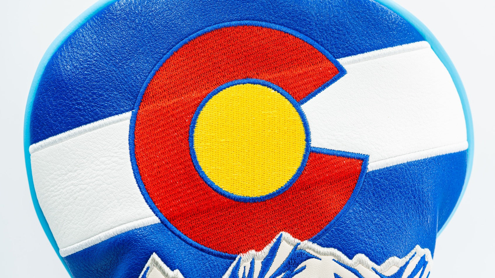 Bold driver cover featuring the Colorado flag design with vibrant colors and mountain details, perfect for stylish golfers.