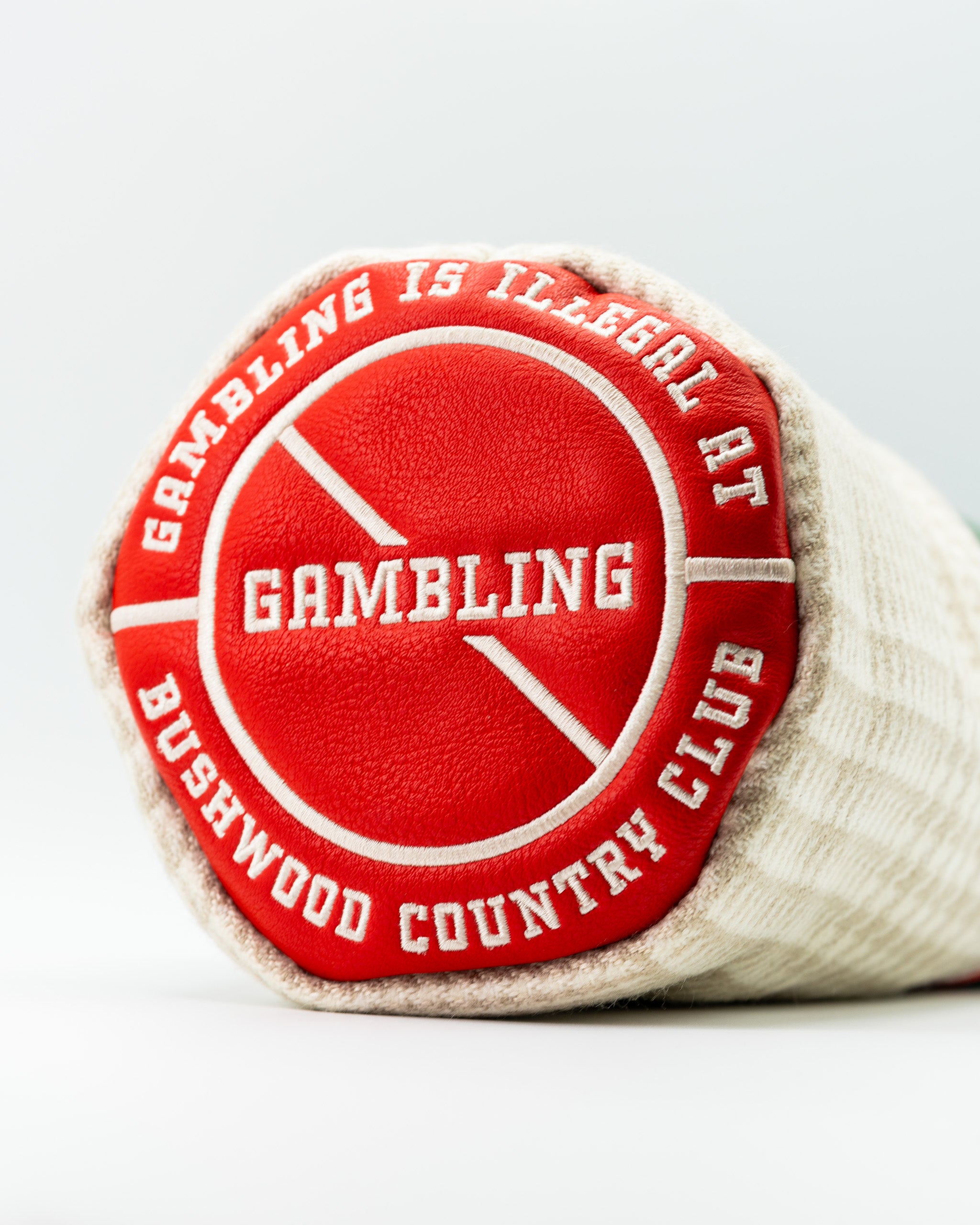 Bushwood CC driver cover featuring a bold red and white design with the text "Gambling is illegal at Bushwood Country Club.