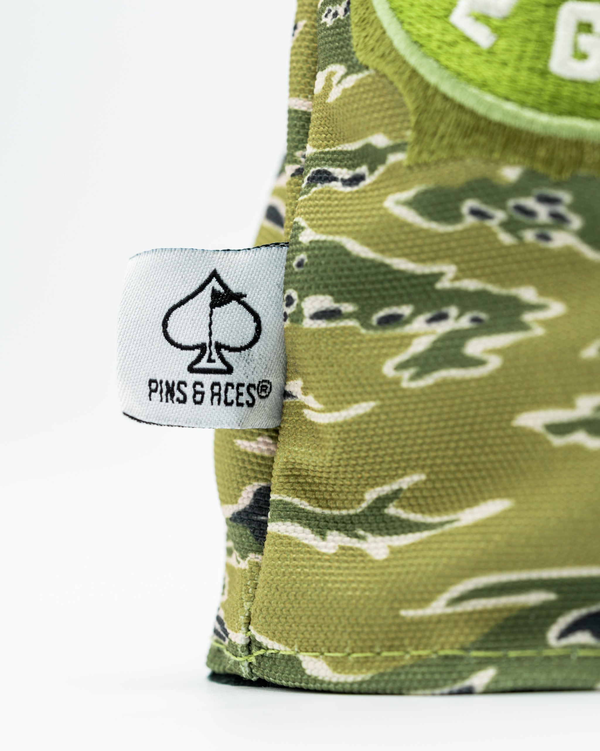Camouflage driver cover featuring a mallard design and the Pins & Aces logo for stylish golf protection.