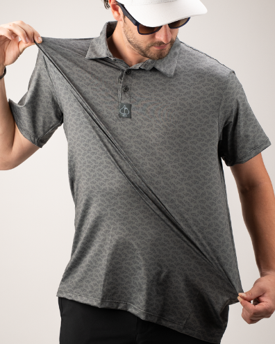 Men's golf polo shirt featuring a unique pattern, lightweight fabric, and a classic collar for a stylish look on the course.