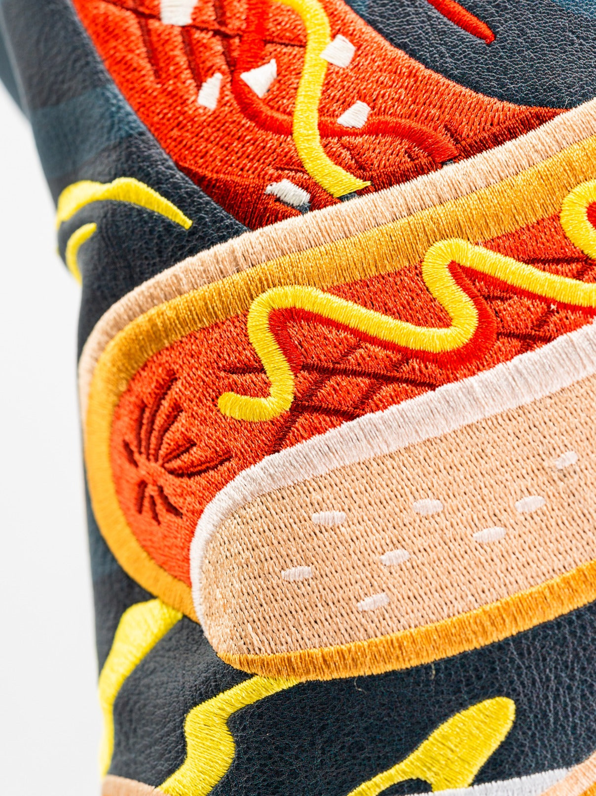 Bold driver cover featuring vibrant embroidery of a hot dog with mustard and toppings, perfect for standout golf style.