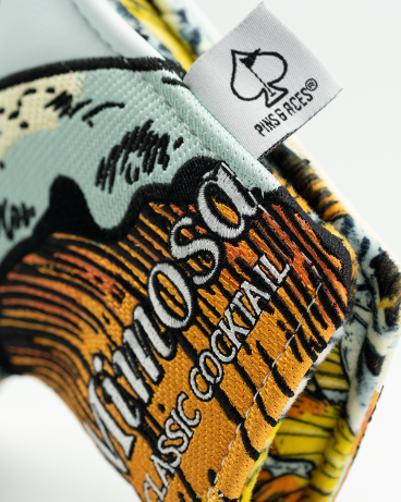Colorful Mimosa blade putter cover featuring a vibrant cocktail design, perfect for golfers seeking unique style on the course.