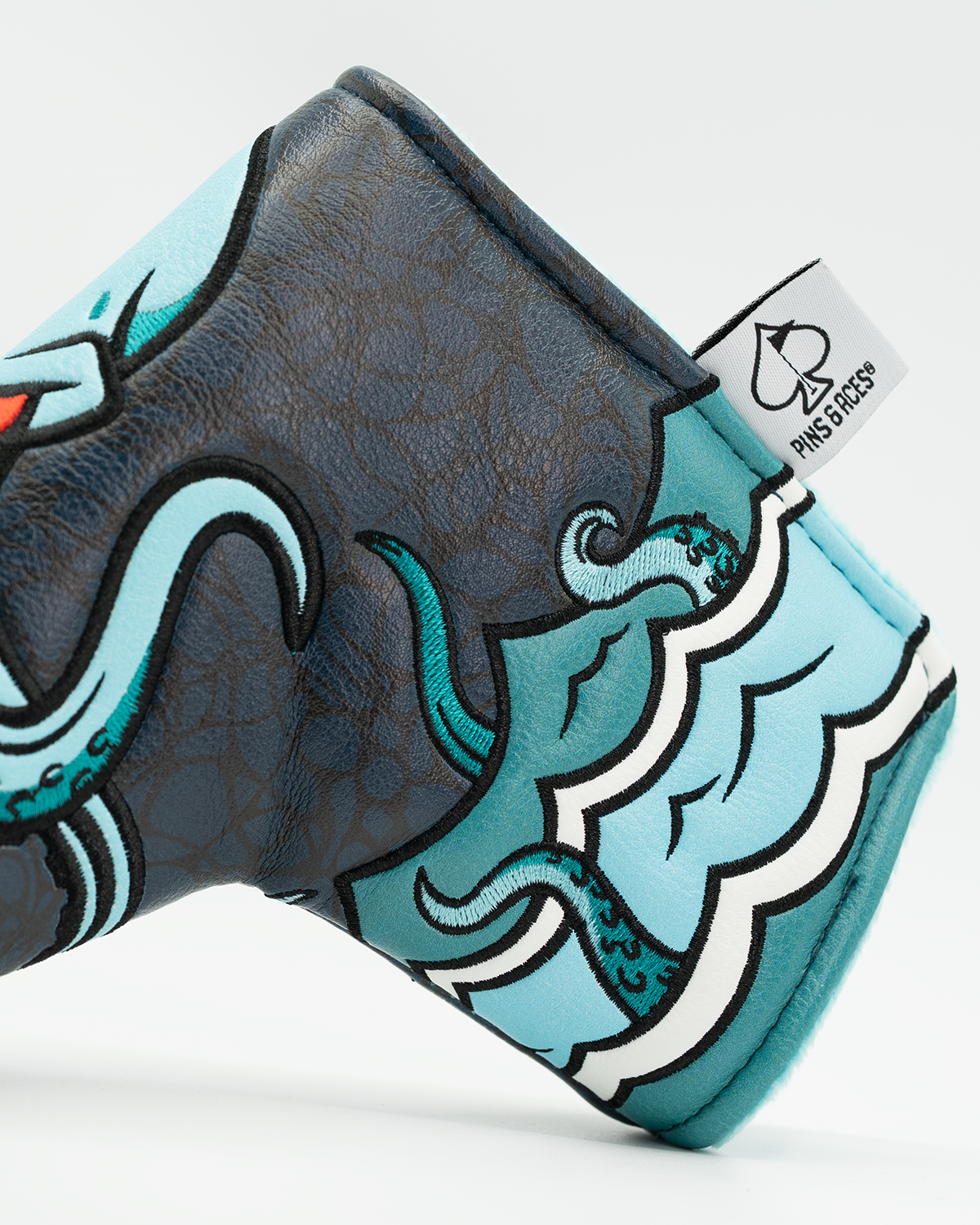 Kraken blade putter cover featuring vibrant octopus design and detailed wave patterns for bold golf style.