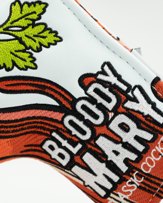 Bold Bloody Mary blade putter cover featuring vibrant graphics and a unique cocktail design for standout golf style.