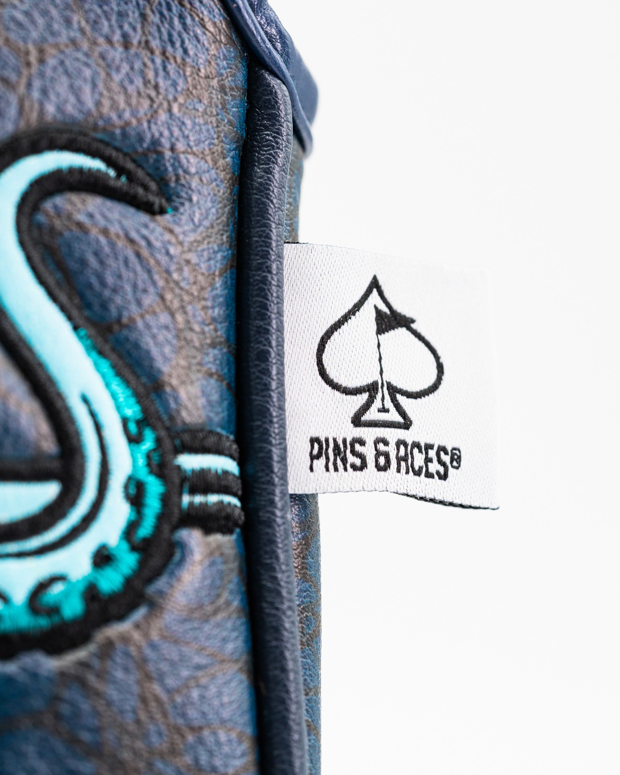 Bold Kraken mallet putter cover featuring a vibrant design and Pins and Aces logo, perfect for standout golfers.