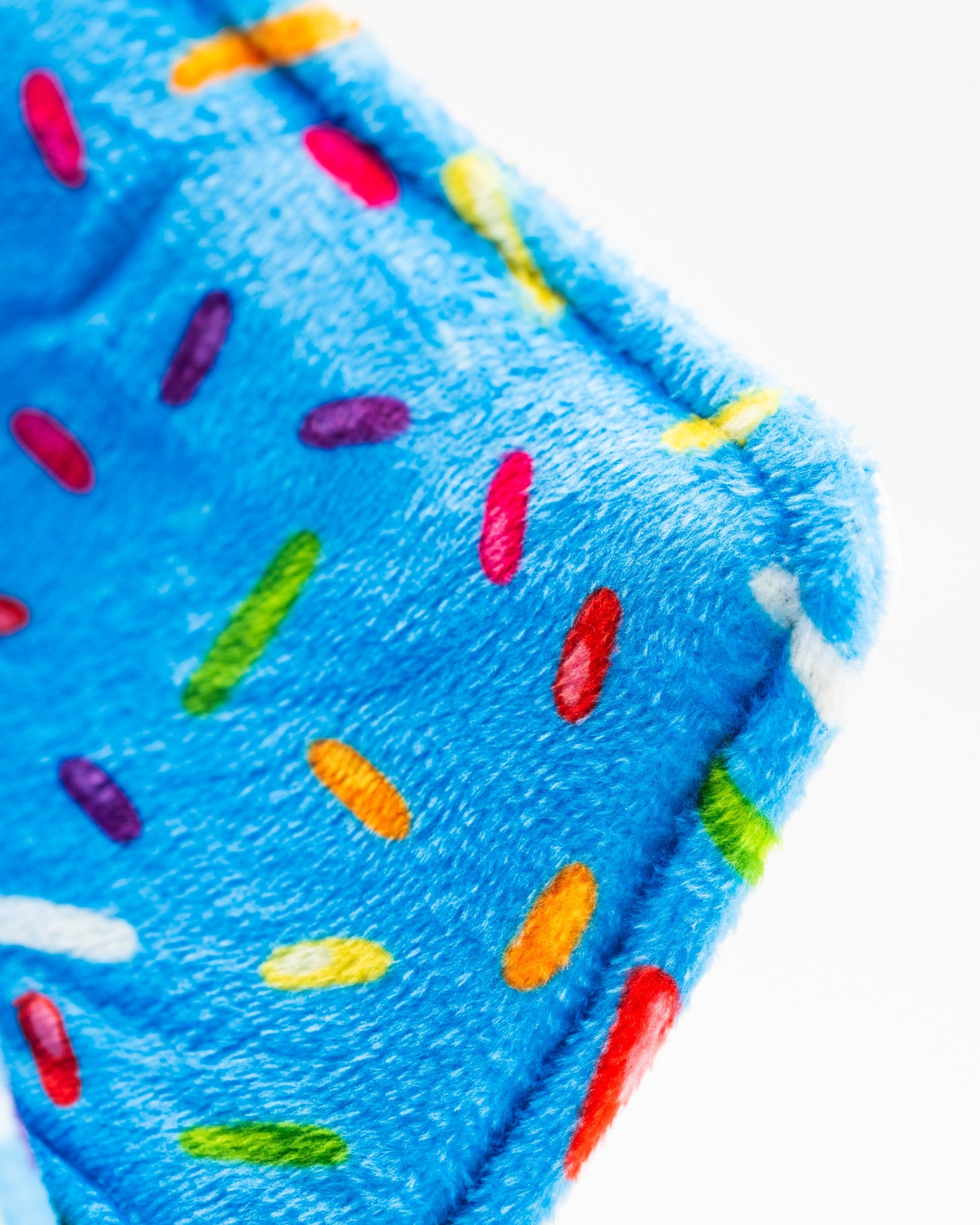 Bright blue blade putter cover featuring colorful sprinkles design, perfect for golfers seeking a fun and unique accessory.