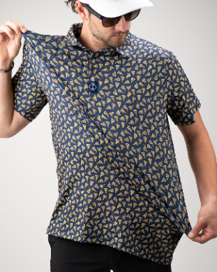 A golfer wearing a navy polo shirt featuring a playful pizza slice pattern, showcasing a fun and bold style on the course.