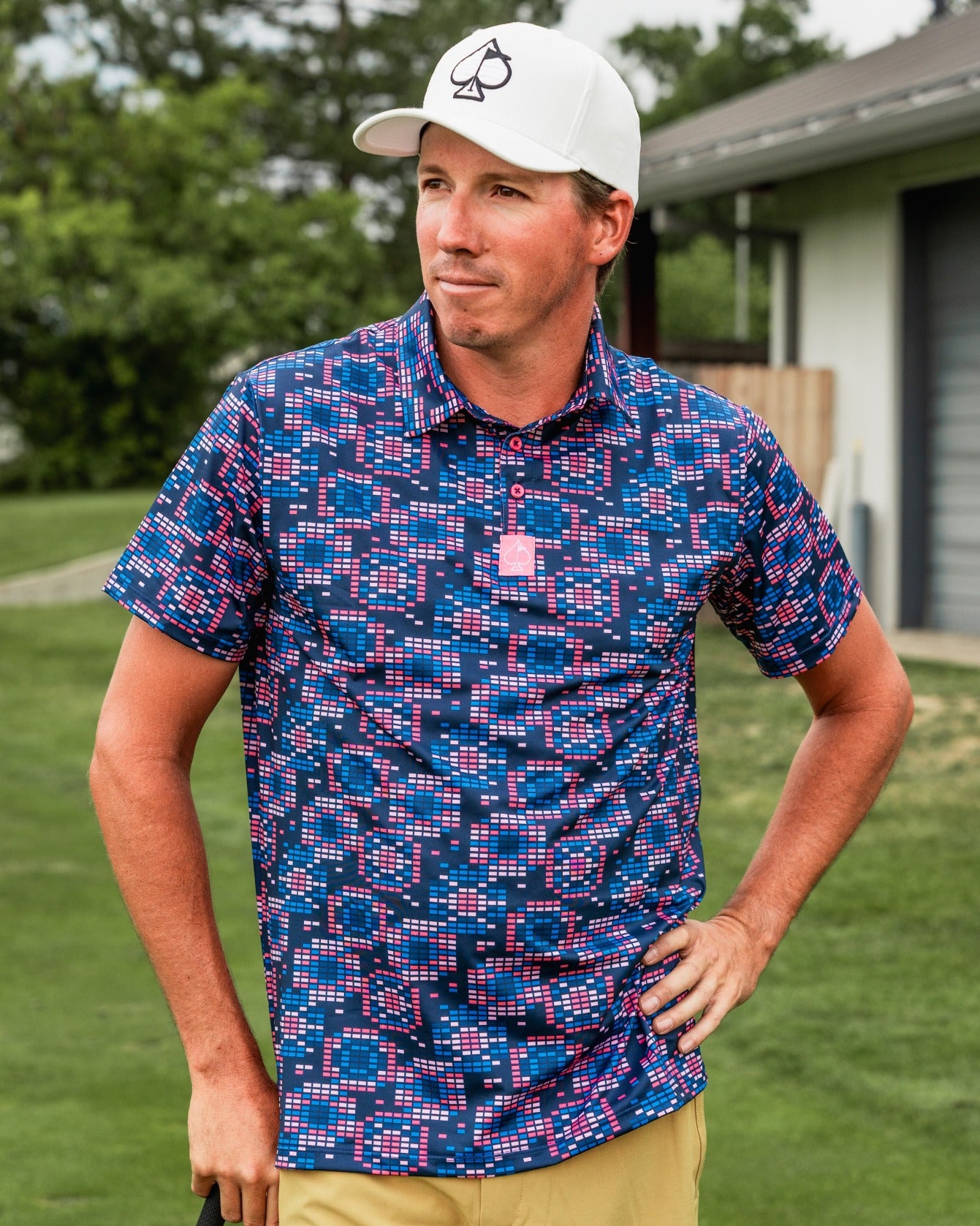Bold Tetrafloral Dark golf shirt featuring a vibrant geometric pattern, perfect for stylish golfers on the course.